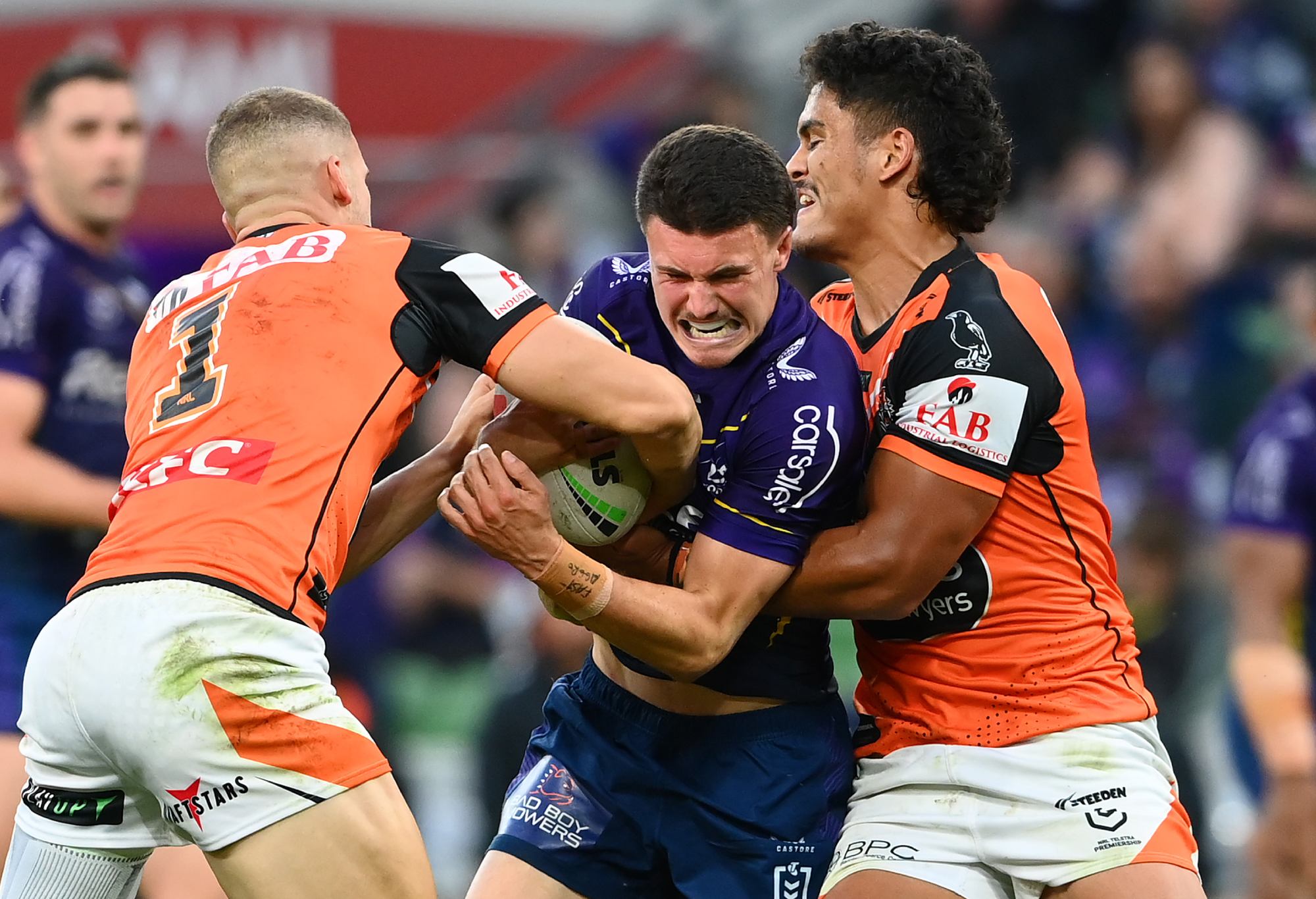 MELBOURNE, AUSTRALIA - MARCH 24: Jonah Pezet of the Storm is tackled during the round four NRL match between the Melbourne Storm and Wests Tigers at AAMI Park on March 24, 2023 in Melbourne, Australia. (Photo by Quinn Rooney/Getty Images)