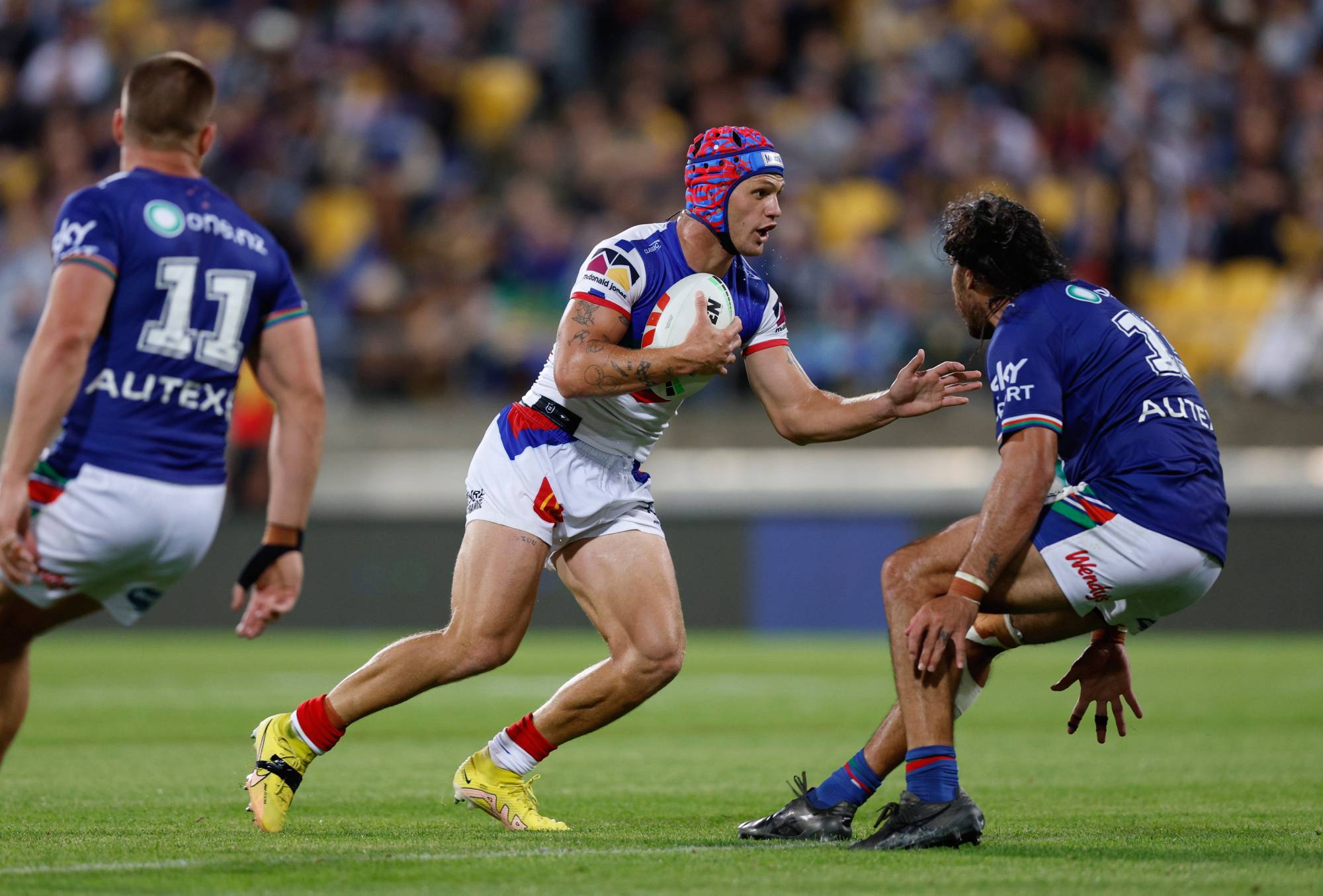 Kalyn Ponga of the Knights makes a break during the round one NRL match between the New Zealand Warriors and Newcastle Knights at Sky Stadium on March 03, 2023 in Wellington, New Zealand.