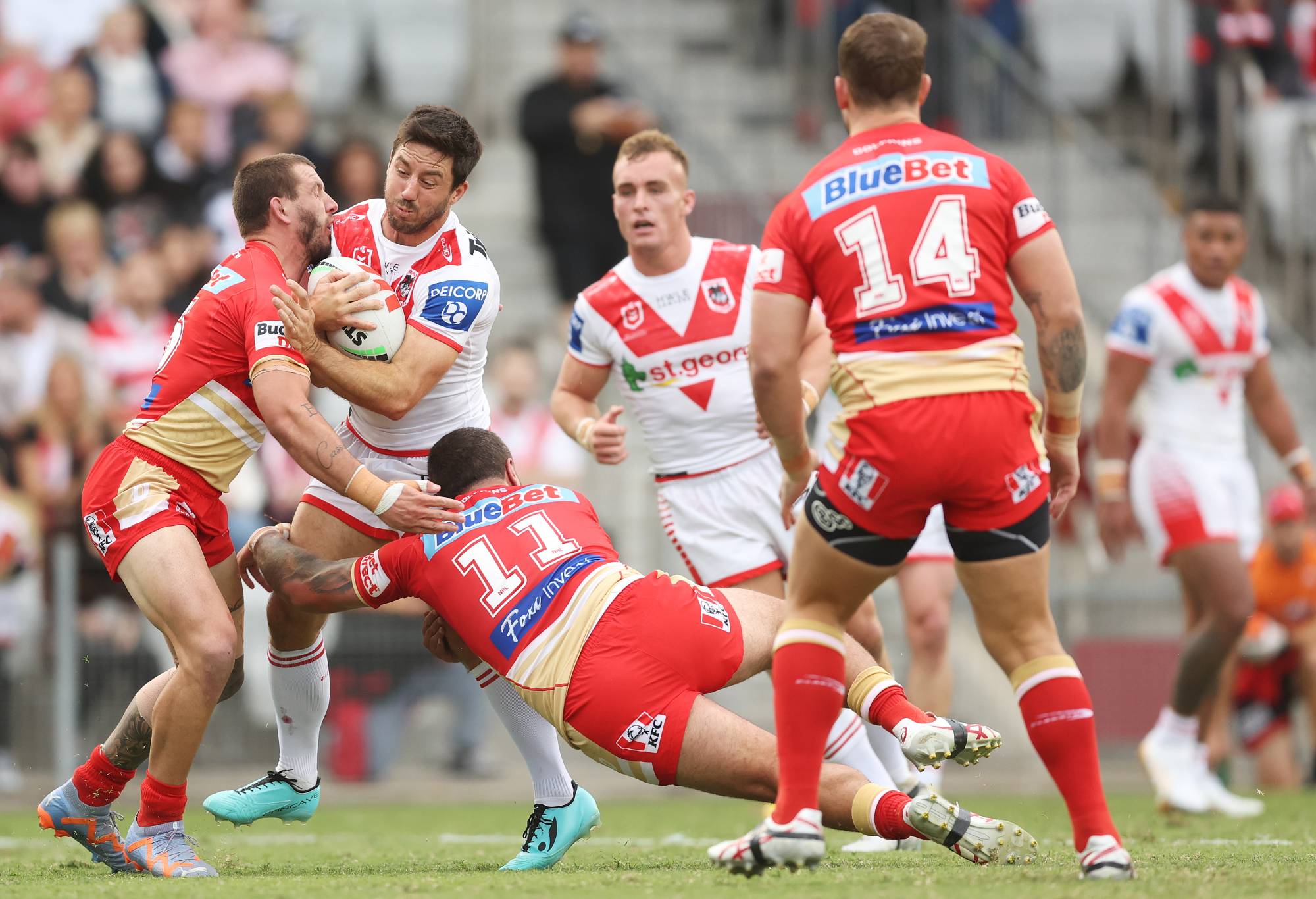 Ben Hunt of the Dragons is tackled during the round five NRL match between St George Illawarra Dragons and Dolphins at WIN Stadium