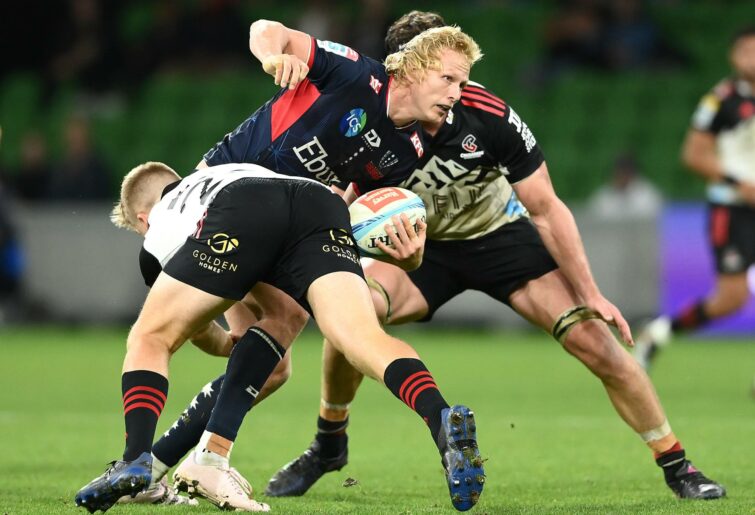 Carter Gordon of the Rebels is tackled during the round nine Super Rugby Pacific match between Melbourne Rebels and Crusaders at AAMI Park, on April 21, 2023, in Melbourne, Australia. (Photo by Quinn Rooney/Getty Images)