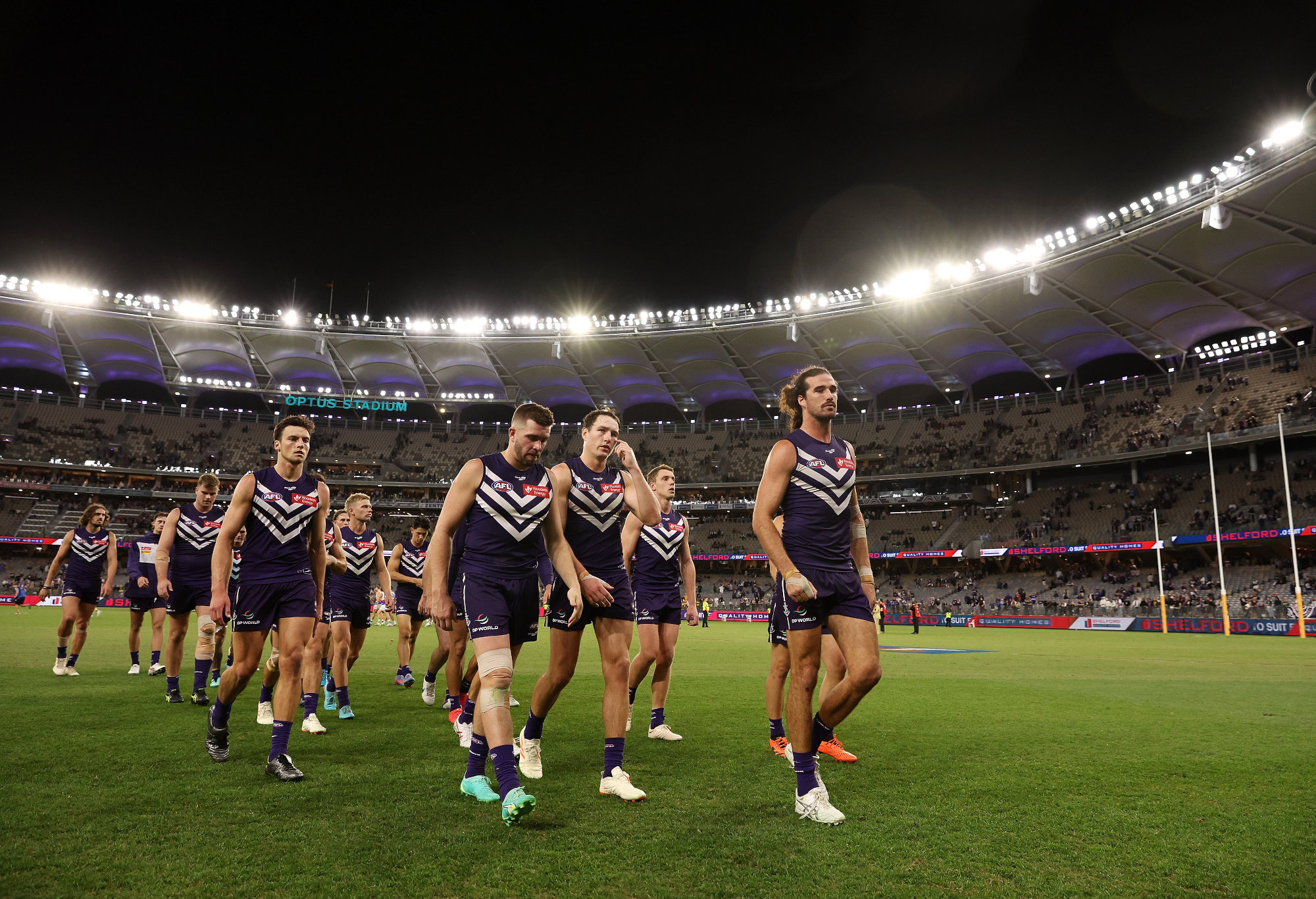 Fremantle players leave the field.
