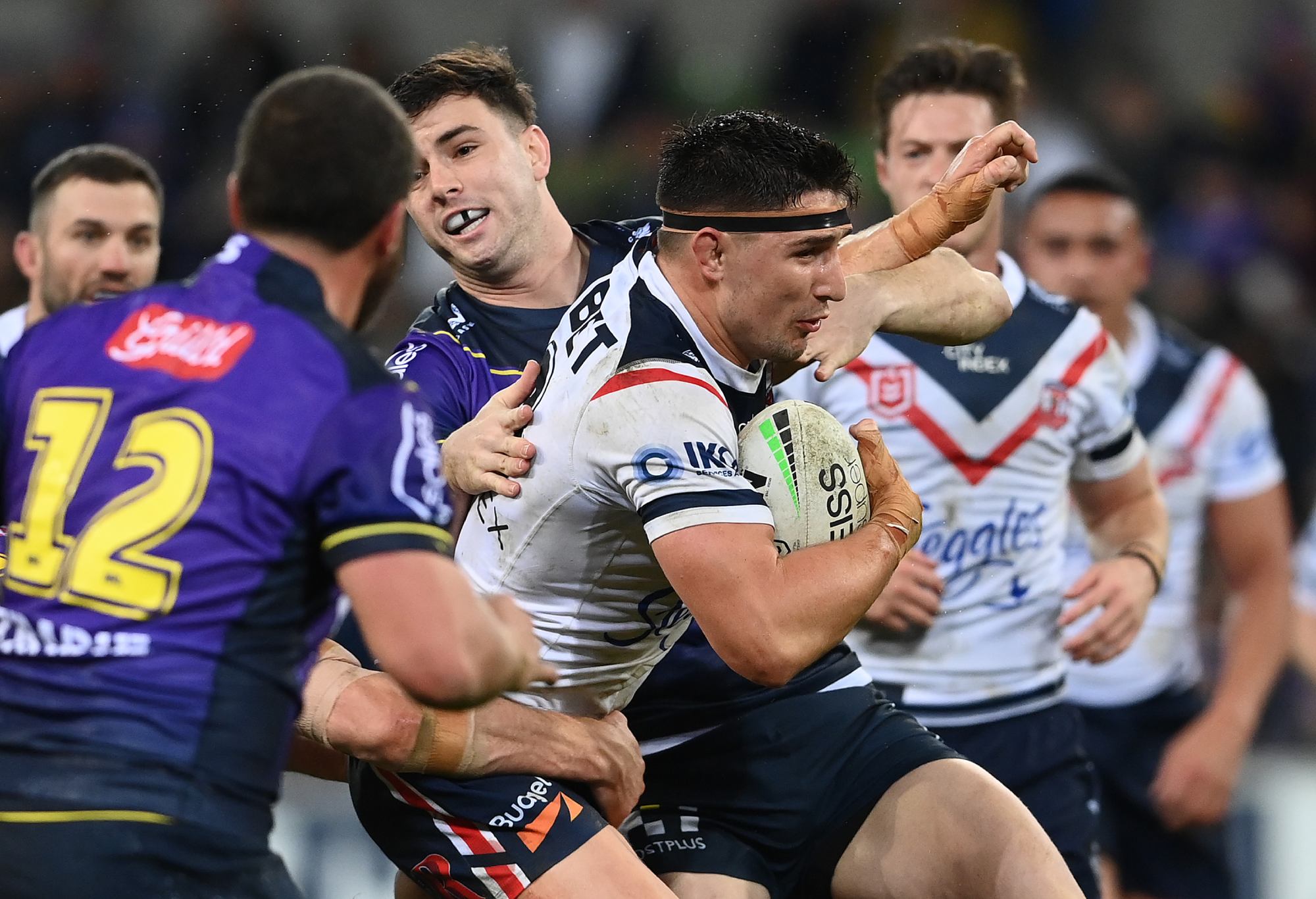 MELBOURNE, AUSTRALIA - AUGUST 26: Victor Radley of the Roosters is tackled during the round 24 NRL match between the Melbourne Storm and the Sydney Roosters at AAMI Park on August 26, 2022, in Melbourne, Australia. (Photo by Quinn Rooney/Getty Images)
