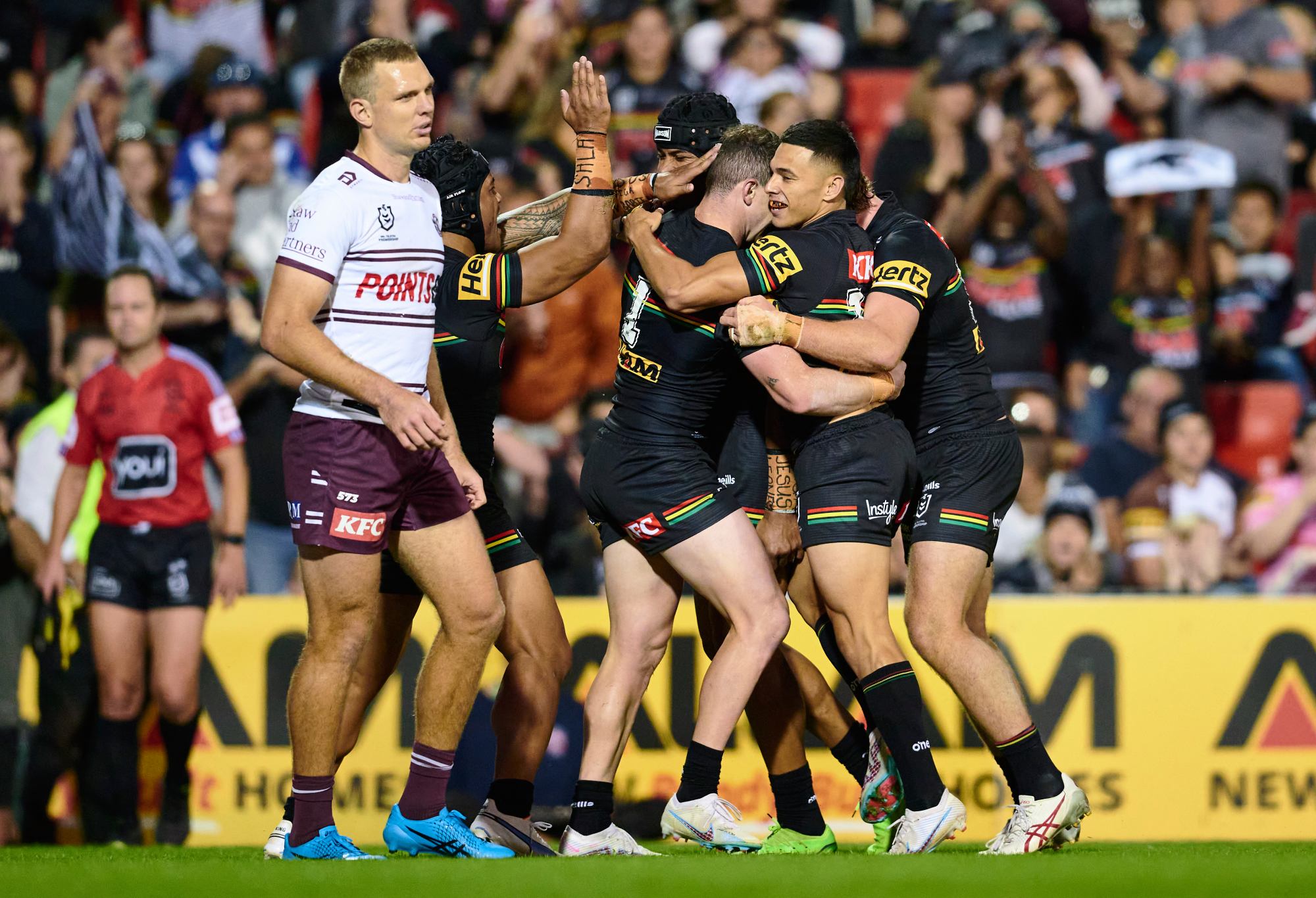 PENRITH, AUSTRALIA - APRIL 08: Dylan Edwards of the Panthers celebrates scoring a try with team mates during the round six NRL match between Penrith Panthers and Manly Sea Eagles at BlueBet Stadium on April 08, 2023 in Penrith, Australia. (Photo by Brett Hemmings/Getty Images)