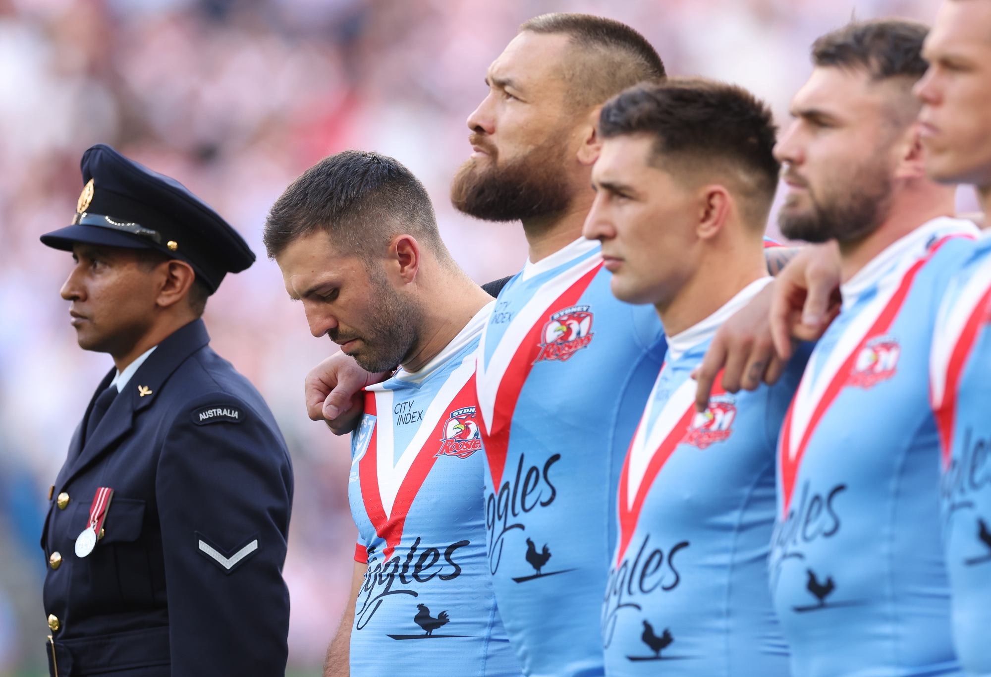 SYDNEY, AUSTRALIA - APRIL 25:  James Tedesco of the Roosters pays his respect during the ANZAC Day ceremony prior to the round eight NRL match between Sydney Roosters and St George Illawarra Dragons at Allianz Stadium on April 25, 2023 in Sydney, Australia. (Photo by Mark Kolbe/Getty Images)