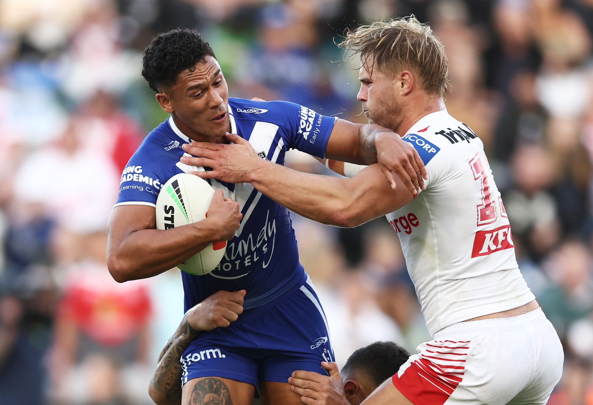 WOLLONGONG, AUSTRALIA - APRIL 30: Hayze Perham of the Bulldogs is tackled during the round nine NRL match between St George Illawarra Dragons and Canterbury Bulldogs at WIN Stadium on April 30, 2023 in Wollongong, Australia. (Photo by Matt King/Getty Images)