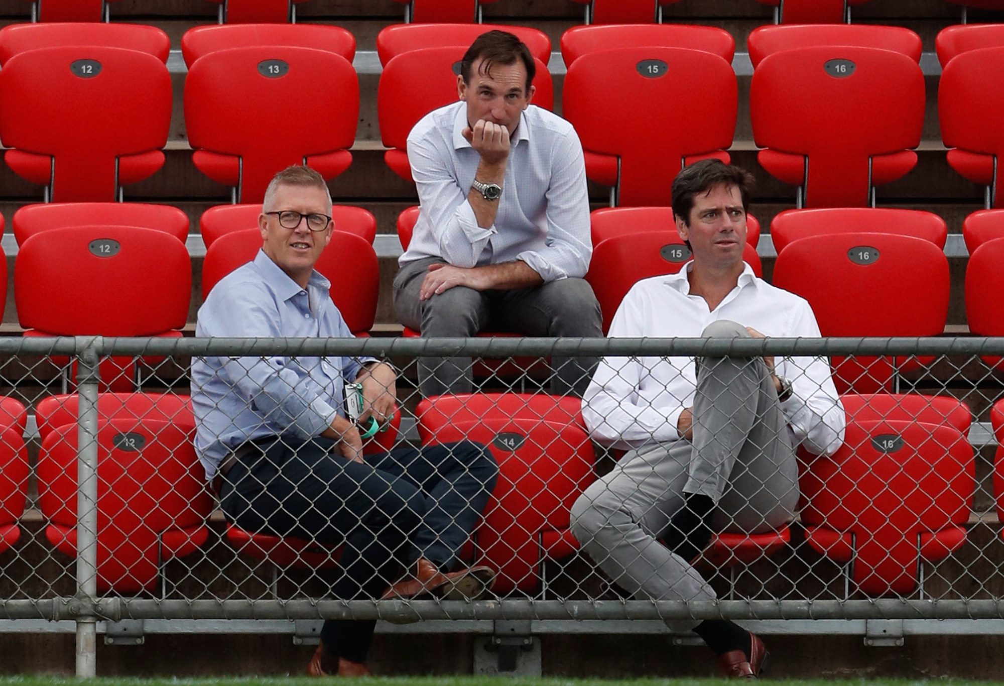 Andrew Dillon (top) sits with former AFL General Manager of Football Operations Steve Hocking and Gillon McLachlan.
