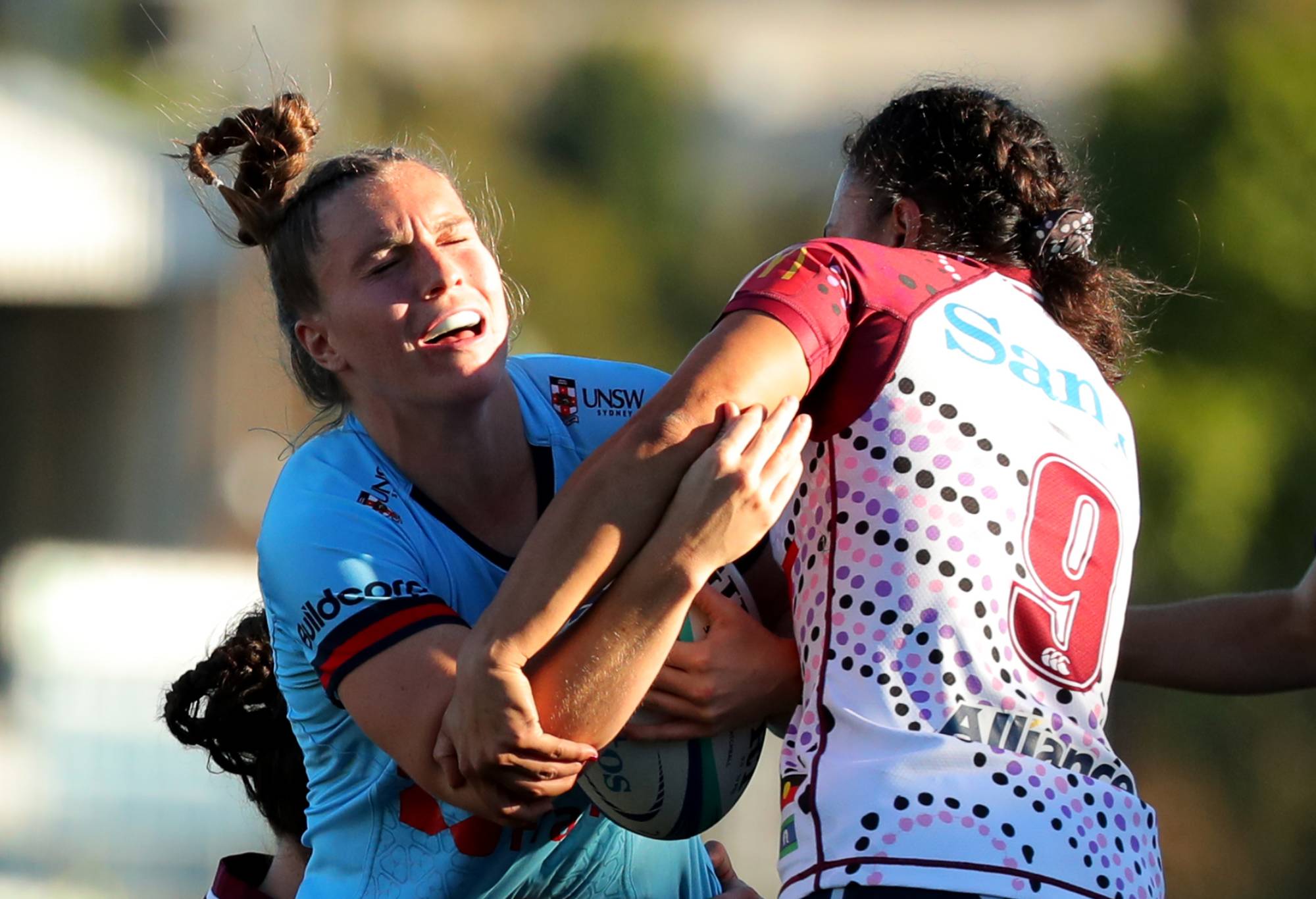 Ella Ryan of the Waratahs is tackled by Dianne Hiini of the Reds during the Super W match between NSW Waratahs Women and Queensland Reds at Concord Oval, on April 16, 2023, in Sydney, Australia. (Photo by Jeremy Ng/Getty Images)