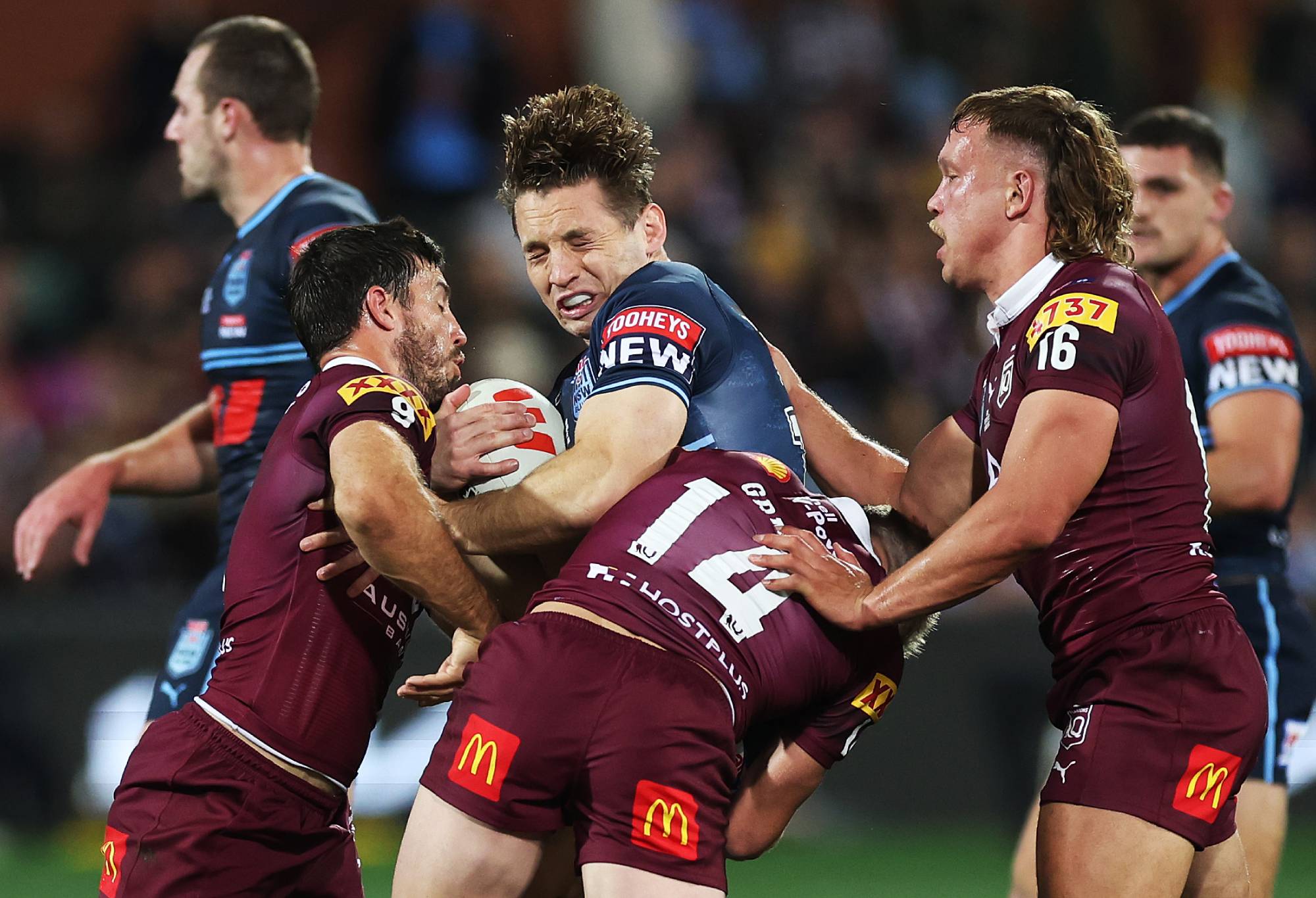 Cameron Murray of the Blues is tackled by Harry Grant and Ben Hunt of the Maroons during game one of the 2023 State of Origin series between the Queensland Maroons and New South Wales Blues at Adelaide Oval on May 31, 2023 in Adelaide, Australia. (Photo by Mark Kolbe/Getty Image