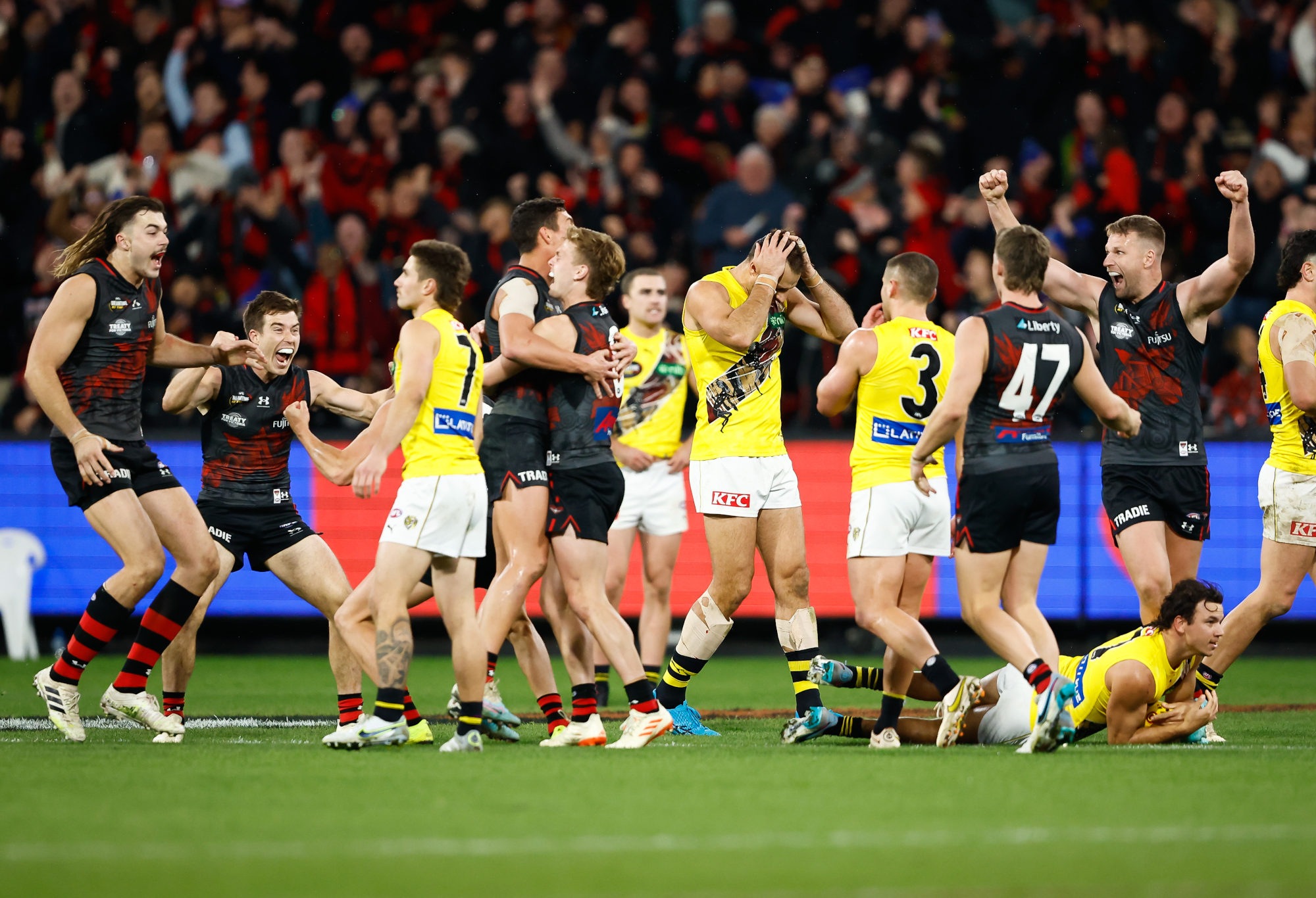 Essendon players celebrate their Dreamtime at the 'G victory over Richmond.