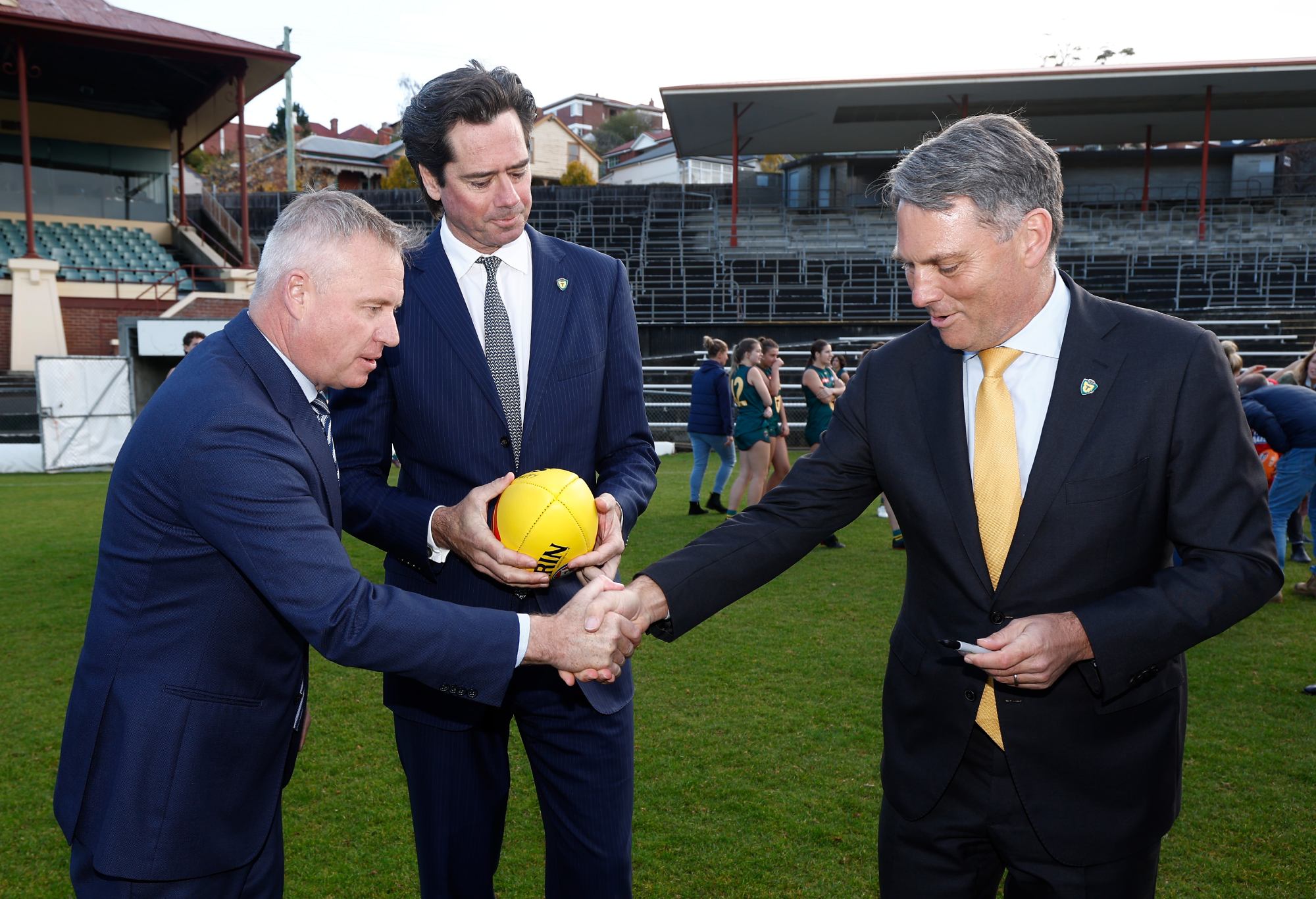 HOBART, AUSTRALIA - MAY 03: (L-R) Tasmanian Premier Jeremy Rockliff, Gillon McLachlan, Chief Executive Officer of the AFL and Deputy PM Richard Marles are seen after signing a commemorative football during the AFL Tasmanian Team Announcement at North Hobart Oval on May 03, 2023 in Hobart, Australia. (Photo by Michael Willson/AFL Photos via Getty Images)