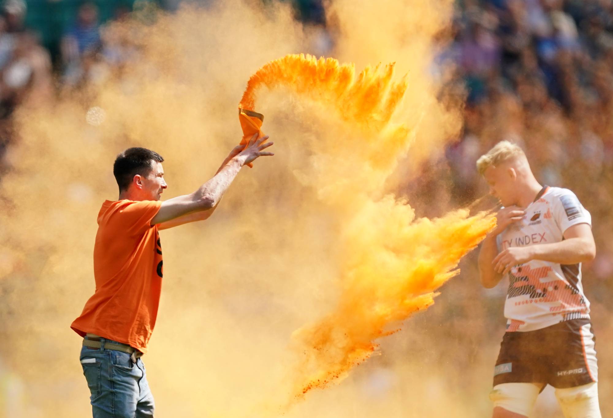 A Just Stop Oil throws orange powder on the pitch during the Gallagher Premiership final at Twickenham Stadium, London. Picture date: Saturday May 27, 2023. (Photo by Mike Egerton/PA Images via Getty Images)
