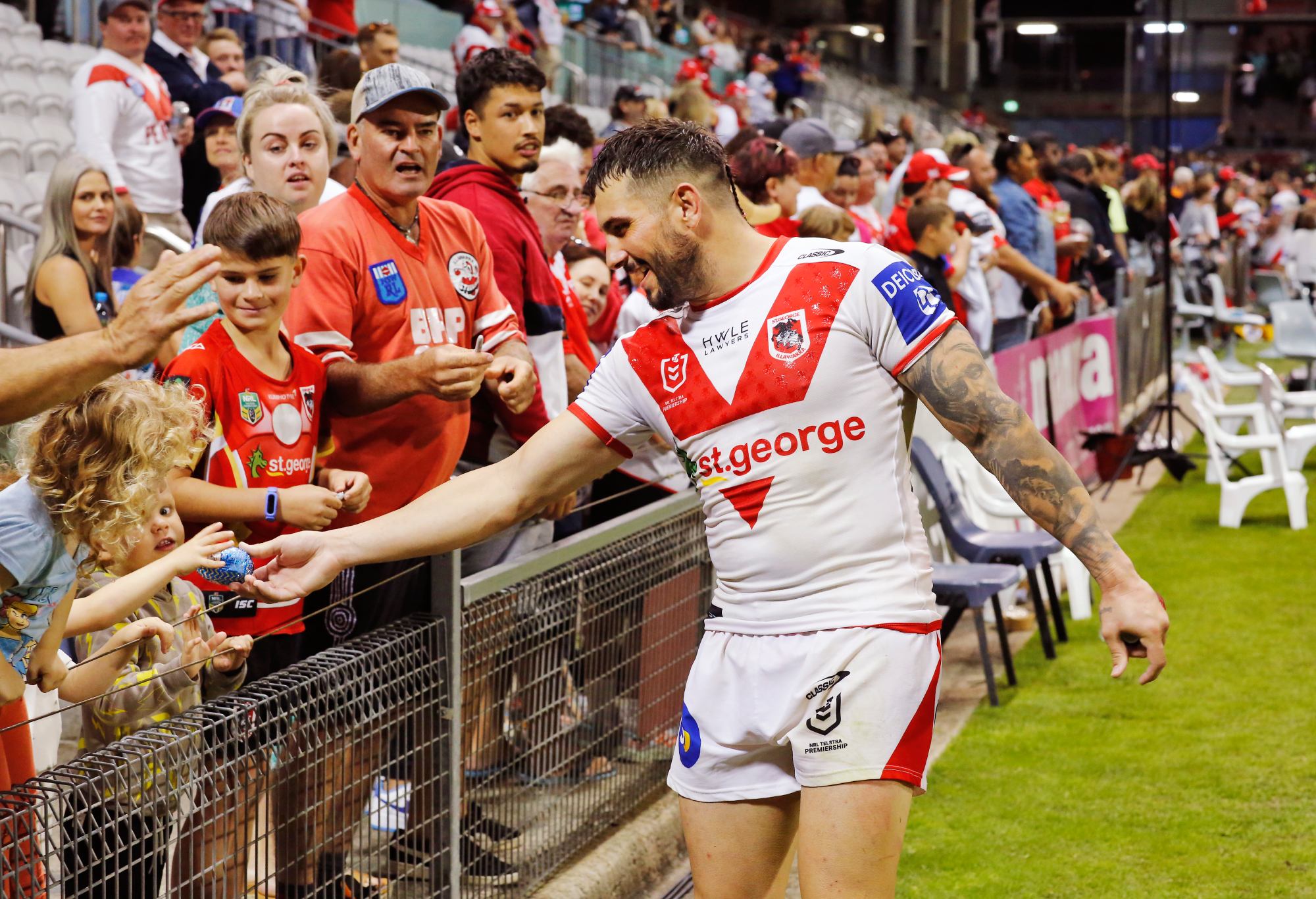 WOLLONGONG, AUSTRALIA - APRIL 17: Jack Bird of the Dragons hands out Easter eggs to the kids after the round six NRL match between the St George Illawarra Dragons and the Newcastle Knights at WIN Stadium, on April 17, 2022, in Wollongong, Australia. (Photo by Mark Evans/Getty Images)