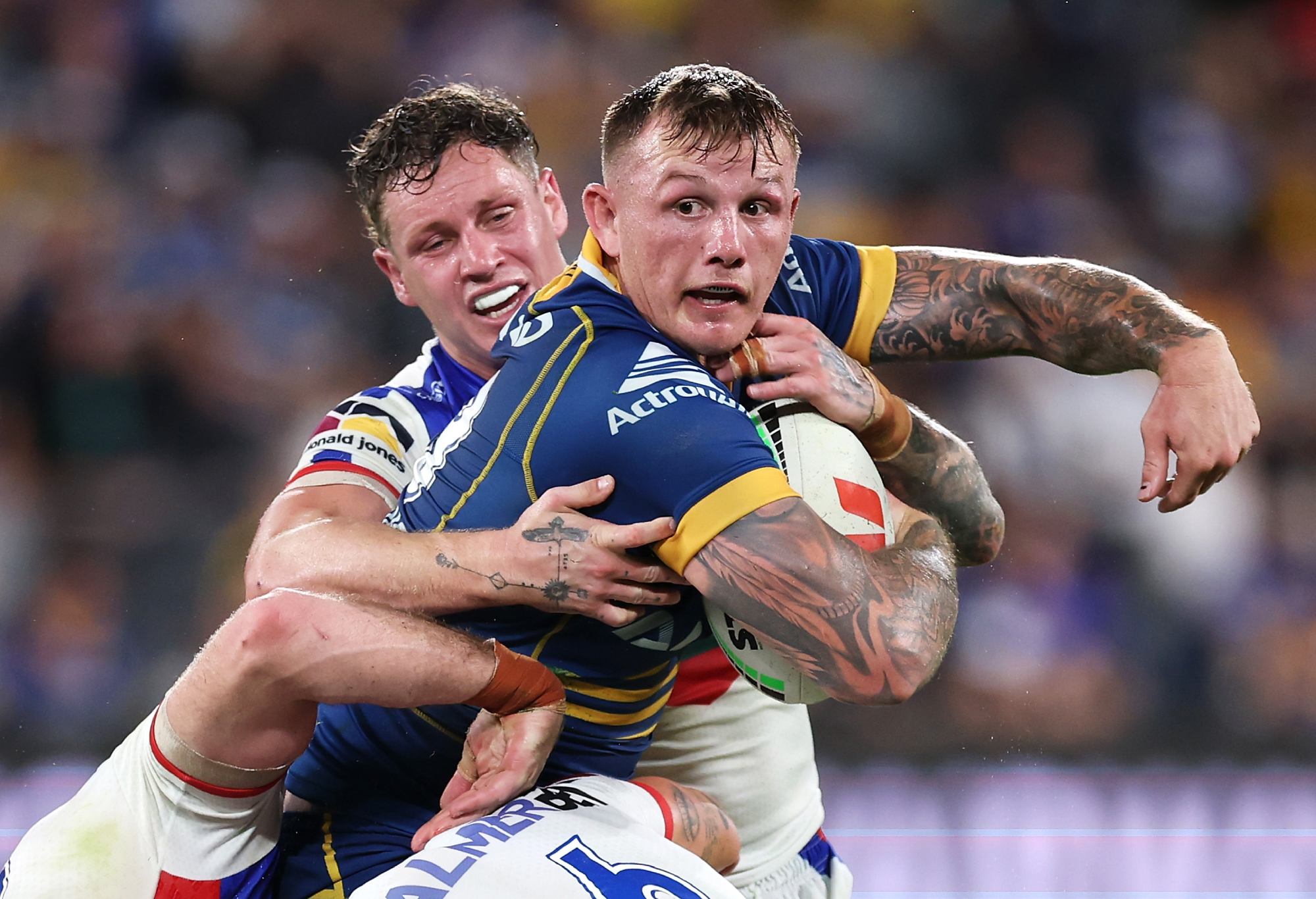 SYDNEY, AUSTRALIA - APRIL 28: J'maine Hopgood of the Eels looks to pass as he is tackled during the round nine NRL match between Parramatta Eels and Newcastle Knights at CommBank Stadium on April 28, 2023 in Sydney, Australia. (Photo by Mark Kolbe/Getty Images)