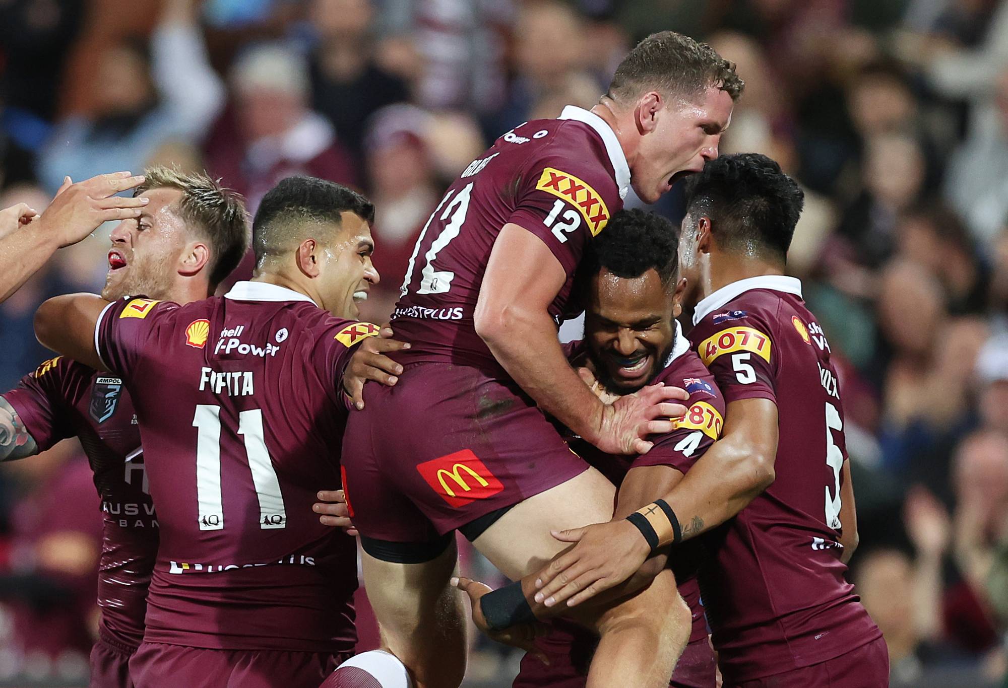 Hamiso Tabuai-Fidow of the Maroons celebrates scoring a try with team mates during game one of the 2023 State of Origin series between the Queensland Maroons and New South Wales Blues at Adelaide Oval on May 31, 2023 in Adelaide, Australia. (Photo by Mark Kolbe/Getty Images)