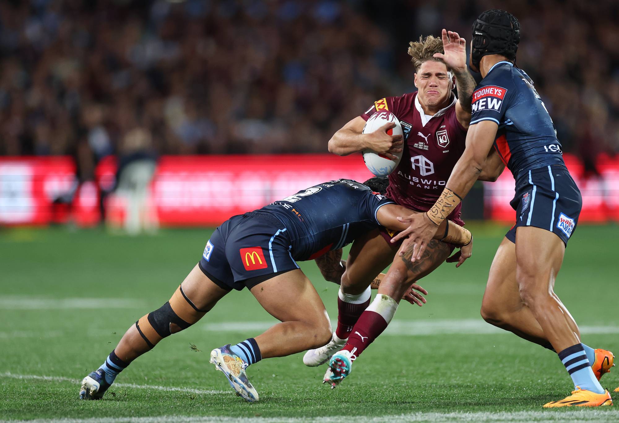 Reece Walsh of the Maroons is tackled during game one of the 2023 State of Origin series between the Queensland Maroons and New South Wales Blues at Adelaide Oval on May 31, 2023 in Adelaide, Australia. (Photo by Mark Kolbe/Getty Images)