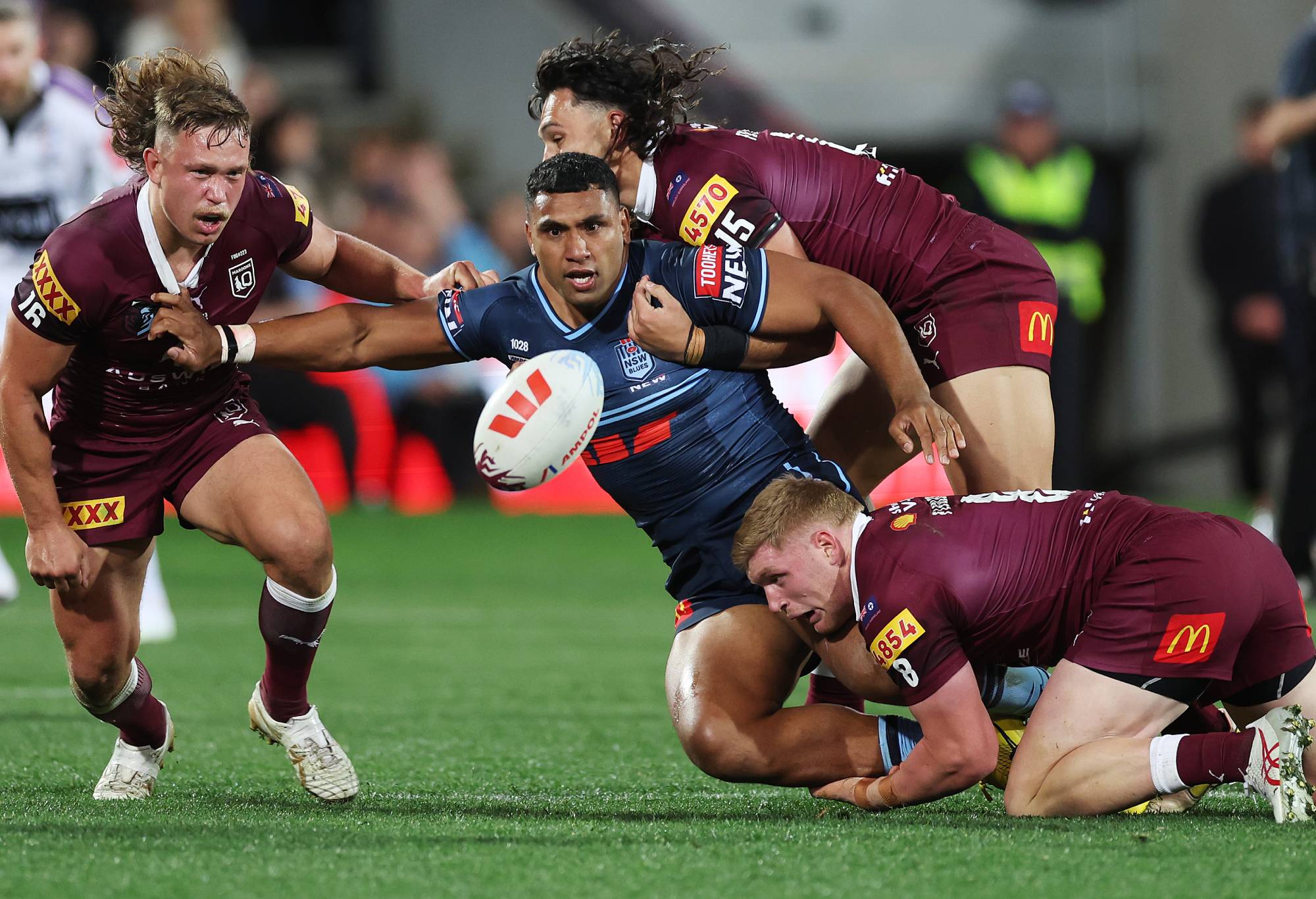 Tevita Pangai Junior of the Blues offloads during game one of the 2023 State of Origin series between the Queensland Maroons and New South Wales Blues at Adelaide Oval on May 31, 2023 in Adelaide, Australia. (Photo by Mark Kolbe/Getty Images)