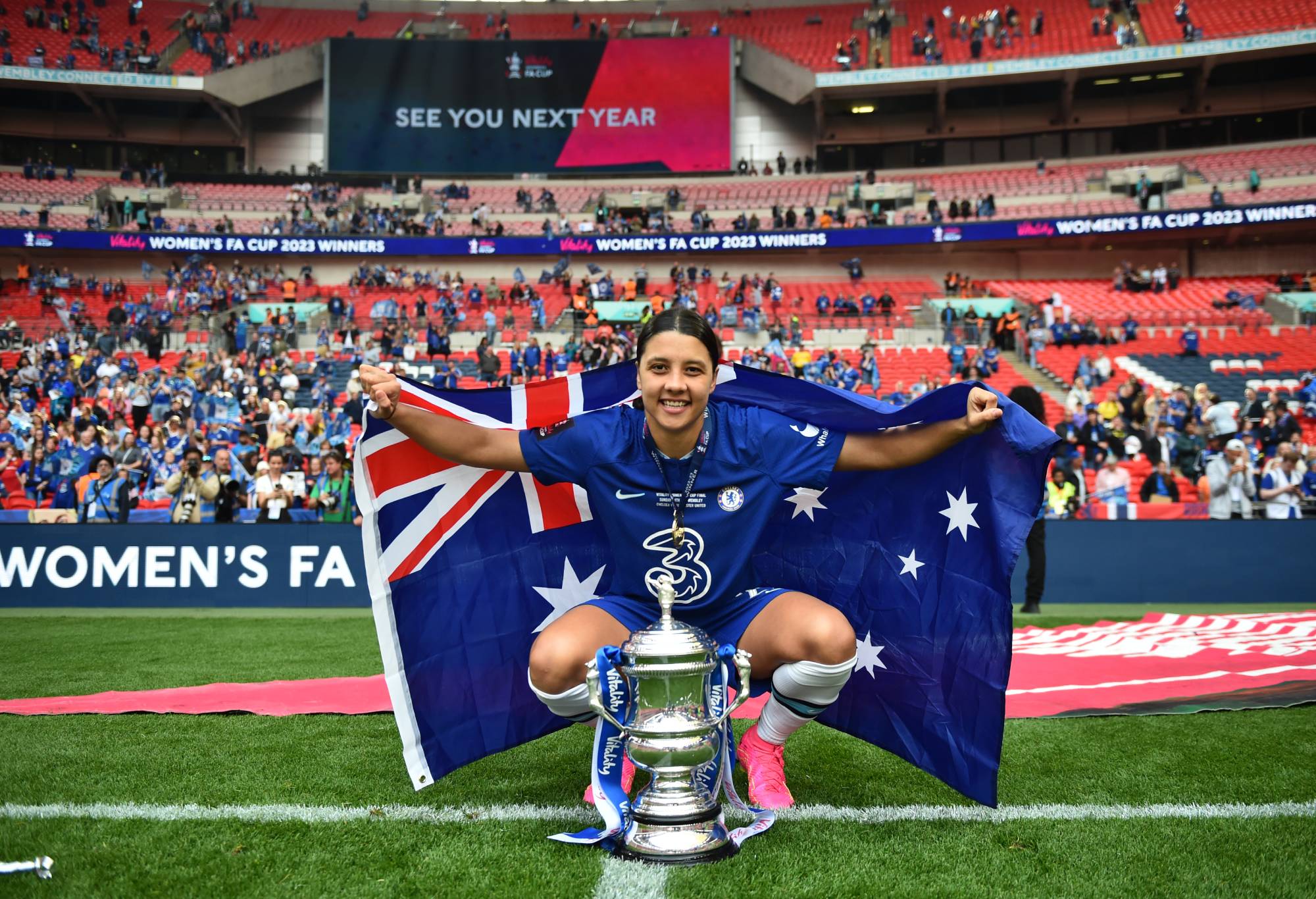 Sam Kerr of Chelsea celebrates with the Vitality Women's FA Cup trophy following her victory in the Vitality Women's FA Cup Final between Chelsea FC and Manchester United at Wembley Stadium on May 14, 2023 in London, England. (Photo by Harriet Lander - Chelsea FC/Chelsea FC via Getty Images)