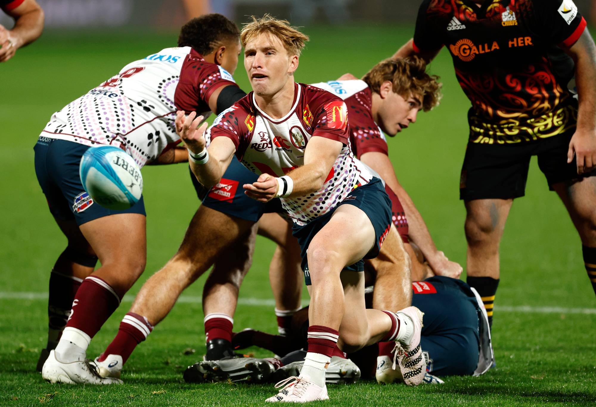 Tate McDermott of the Reds plays the ball during the Super Rugby Pacific Round 12 game between the Chiefs and Queensland Reds at Yarrow Stadium on May 12, 2023 in New Plymouth, New Zealand. (Photo by Andy Jackson/Getty Images)