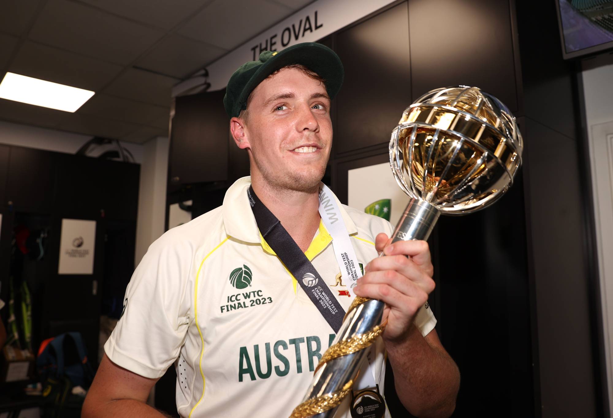 Cameron Green of Australia poses for a photo with the ICC World Test Championship Mace in the changing room on day five of the ICC World Test Championship Final between Australia and India at The Oval on June 11, 2023 in London, England. (Photo by Ryan Pierse-ICC/ICC via Getty Images)