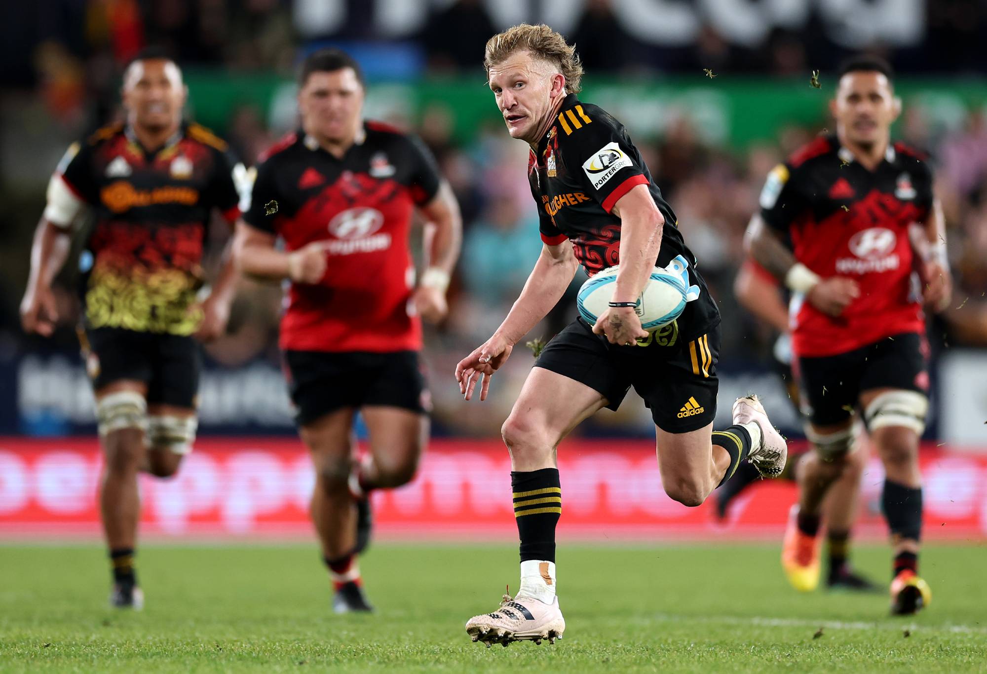 Damian McKenzie of the Chiefs charges forward during the Super Rugby Pacific Final match between Chiefs and Crusaders at FMG Stadium Waikato, on June 24, 2023, in Hamilton, New Zealand. (Photo by Phil Walter/Getty Images)