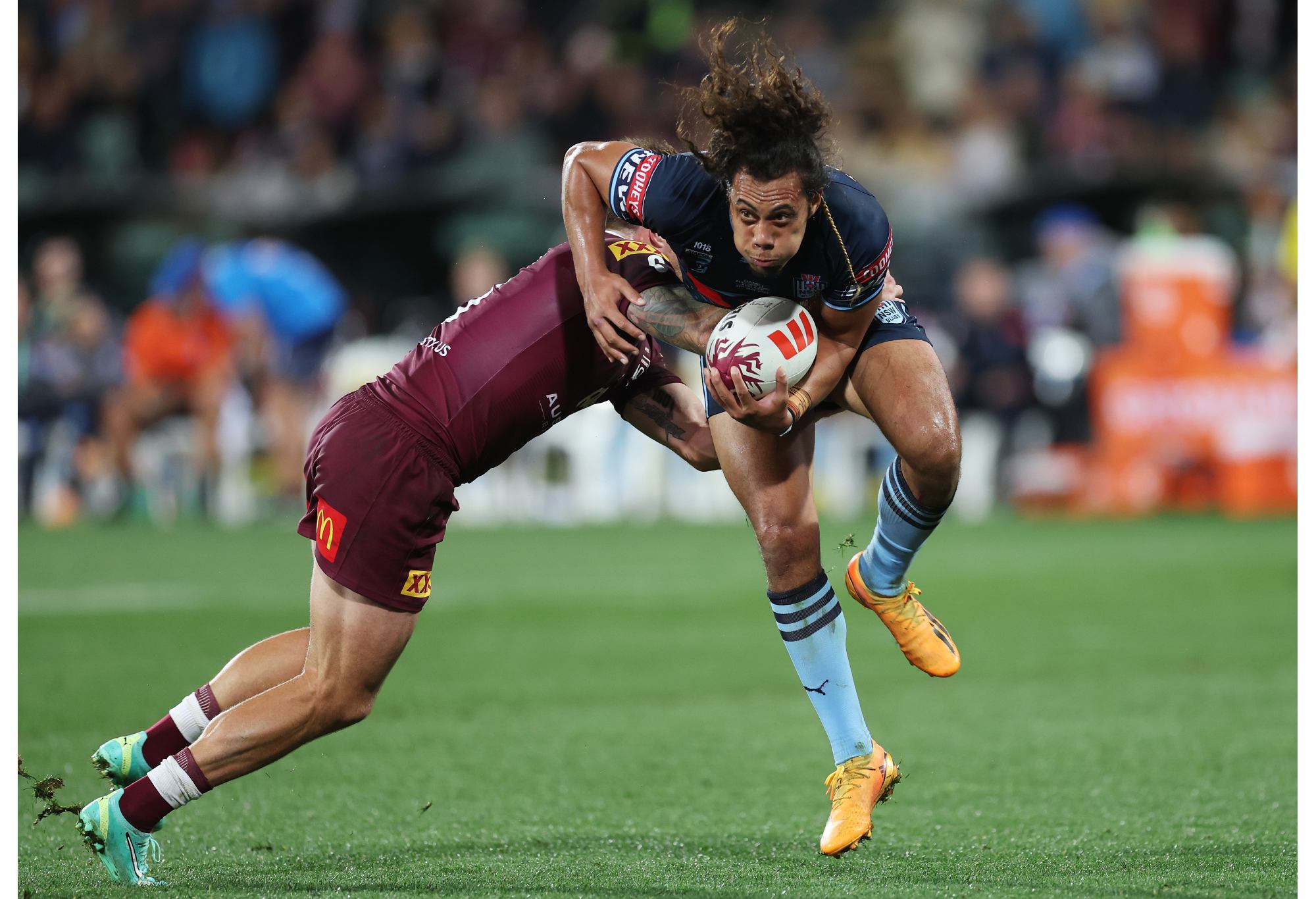 ADELAIDE, AUSTRALIA - MAY 31: Jarome Luai of the Blues is tackled by Cameron Munster of the Maroons during game one of the 2023 State of Origin series between the Queensland Maroons and New South Wales Blues at Adelaide Oval on May 31, 2023 in Adelaide, Australia. (Photo by Mark Kolbe/Getty Images)