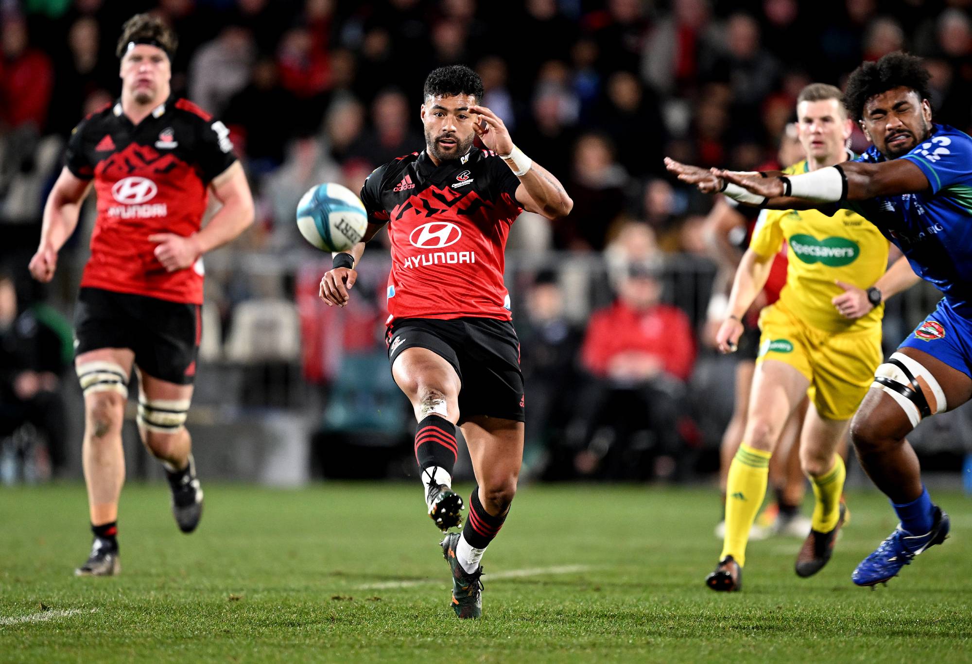 Richie Mo'unga of the Crusaders kicks the ball during the Super Rugby Pacific Quarter Final match between Crusaders and Drua at Orangetheory Stadium, on June 10, 2023, in Christchurch, New Zealand. (Photo by Joe Allison/Getty Images)