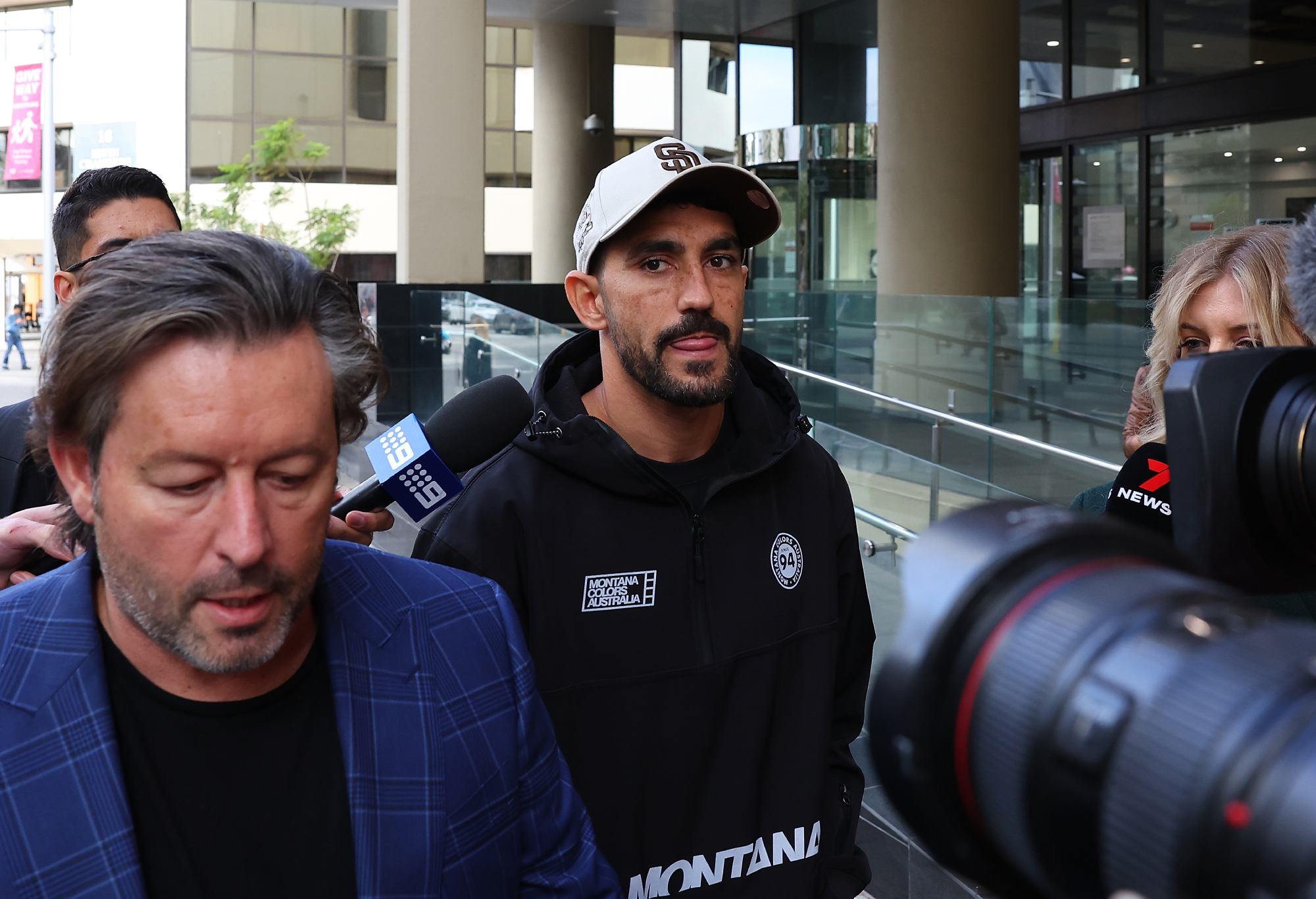 PERTH, AUSTRALIA - JUNE 12: Richmond Tigers AFL player Marlion Pickett and his manager Anthony Van Der Wielen walk out from the Perth Magistrates Court on June 12, 2023 in Perth, Australia. Pickett has been accused of involvement in burglaries in December 2022 and January 2023. (Photo by Paul Kane/Getty Images)