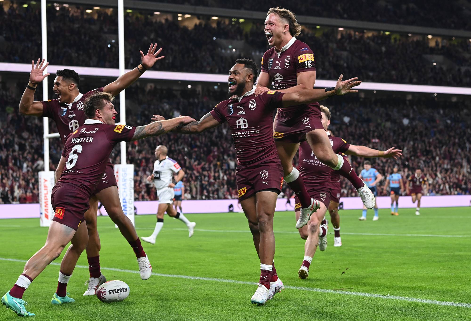 Hamiso Tabuai-Fidow of the Maroons celebrates scoring a try with teammates during game two of the State of Origin series between the Queensland Maroons and the New South Wales Blues at Suncorp Stadium on June 21, 2023 in Brisbane, Australia. (Photo by Bradley Kanaris/Getty Images)