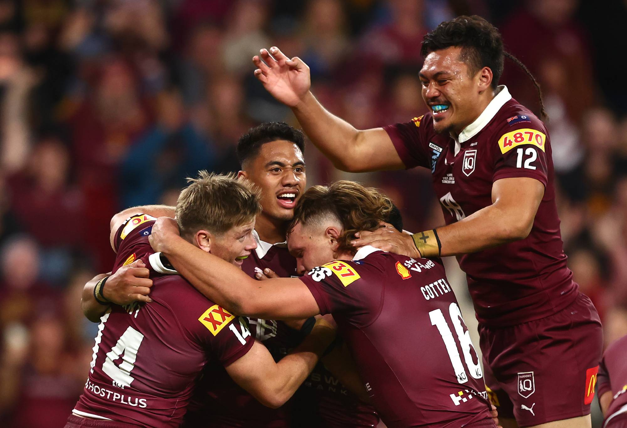 Murray Taulagi of the Maroons celebrates with team mates after scoring a try during game two of the State of Origin series between the Queensland Maroons and the New South Wales Blues at Suncorp Stadium on June 21, 2023 in Brisbane, Australia. (Photo by Chris Hyde/Getty Images)