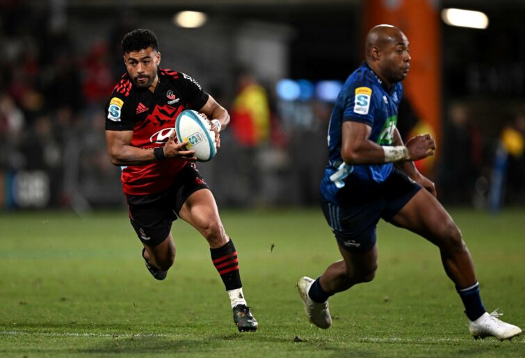 Richie Mo'unga of the Crusaders charges forward during the Super Rugby Pacific Semi Final match between Crusaders and Blues at Orangetheory Stadium, on June 16, 2023, in Christchurch, New Zealand. (Photo by Joe Allison/Getty Images)