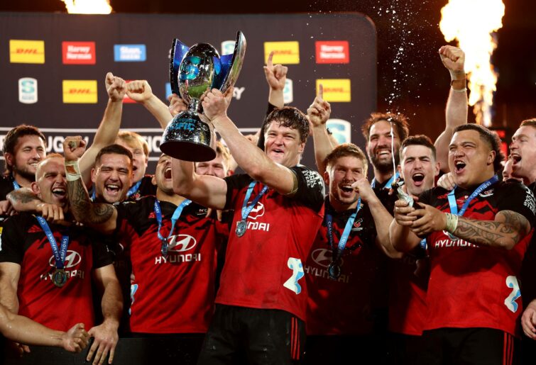 Scott Barrett holds the Super Rugby Pacific trophy as the Crusaders celebrate after winning the Super Rugby Pacific Final match between Chiefs and Crusaders at FMG Stadium Waikato, on June 24, 2023, in Hamilton, New Zealand. (Photo by Phil Walter/Getty Images)