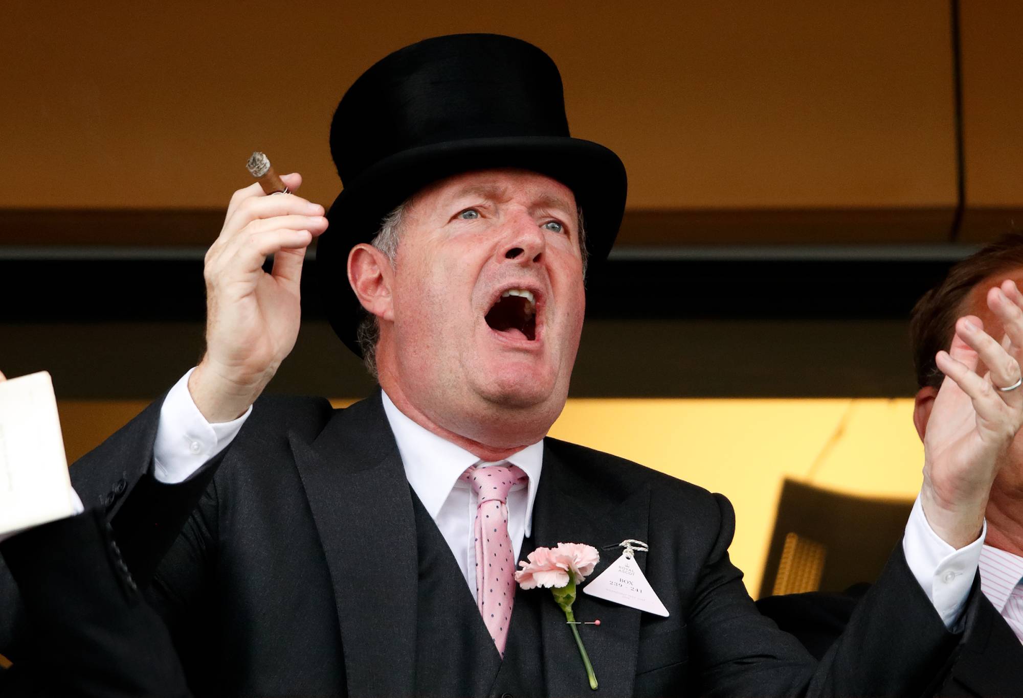 ASCOT, UNITED KINGDOM - JUNE 19: (EMBARGOED FOR PUBLICATION IN UK NEWSPAPERS UNTIL 24 HOURS AFTER CREATE DATE AND TIME) Piers Morgan smokes a cigar whilst watching the racing on day two of Royal Ascot at Ascot Racecourse on June 19, 2019 in Ascot, England. (Photo by Max Mumby/Indigo/Getty Images)