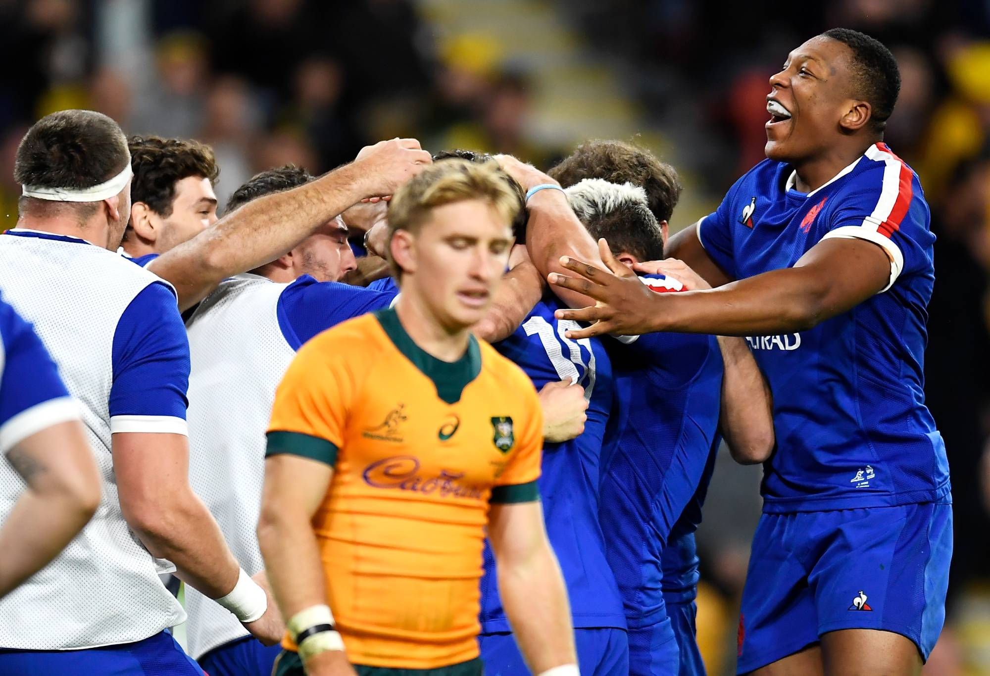 The French players and reserves celebrate with Pierre-Louis Barassi of France after he scored a try during the International Test Match between the Australian Wallabies and France at Suncorp Stadium on July 17, 2021 in Brisbane, Australia. (Photo by Albert Perez/Getty Images)