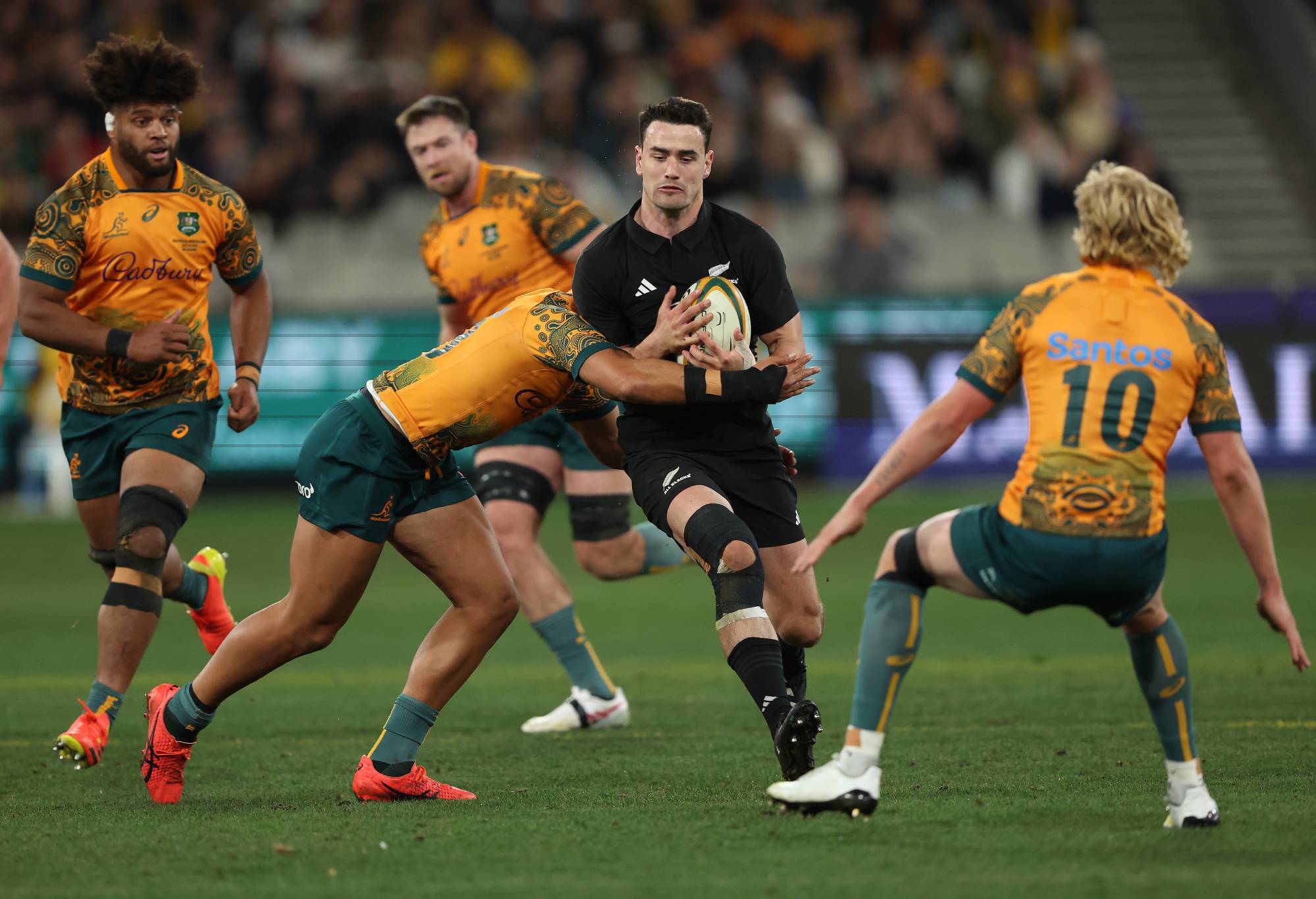 Will Jordan of the All Blacks is tackled during the The Rugby Championship & Bledisloe Cup match between the Australia Wallabies and the New Zealand All Blacks at Melbourne Cricket Ground on July 29, 2023 in Melbourne, Australia. (Photo by Robert Cianflone/Getty Images)