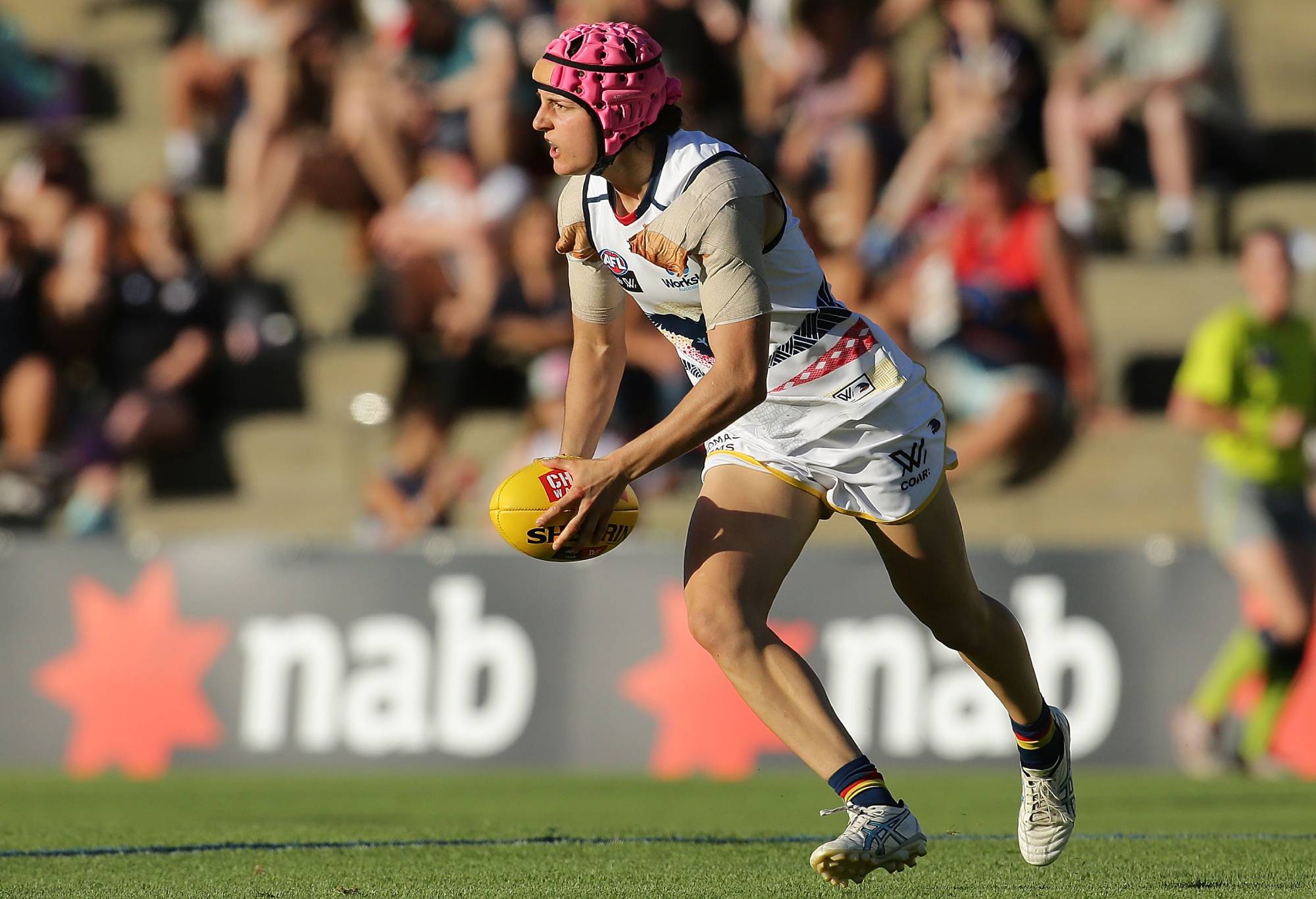 FREMANTLE, WESTERN AUSTRALIA - FEBRUARY 26: Heather Anderson of the Crows looks to pass the ball during the round four AFL Women's match between the Fremantle Dockers and the Adelaide Crows at Fremantle Oval on February 26, 2017 in Fremantle, Australia.  (Photo by Will Russell/AFL Media/Getty Images)