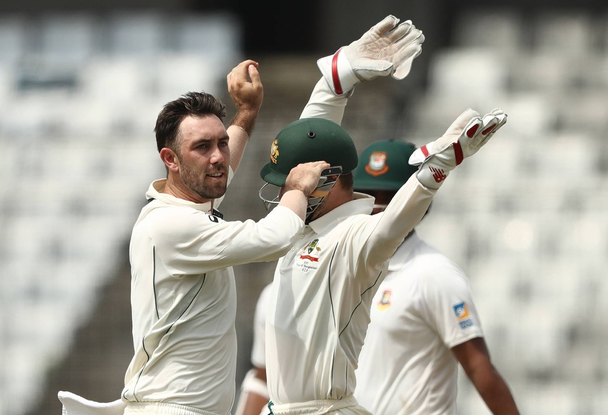 MIRPUR, BANGLADESH - AUGUST 27: Glenn Maxwell of Australia celebrates taking the wicket of Tamim Iqbal Khan of Bangladesh during day one of the First Test match between Bangladesh and Australia at Shere Bangla National Stadium on August 27, 2017 in Mirpur, Bangladesh. (Photo by Robert Cianflone/Getty Images)