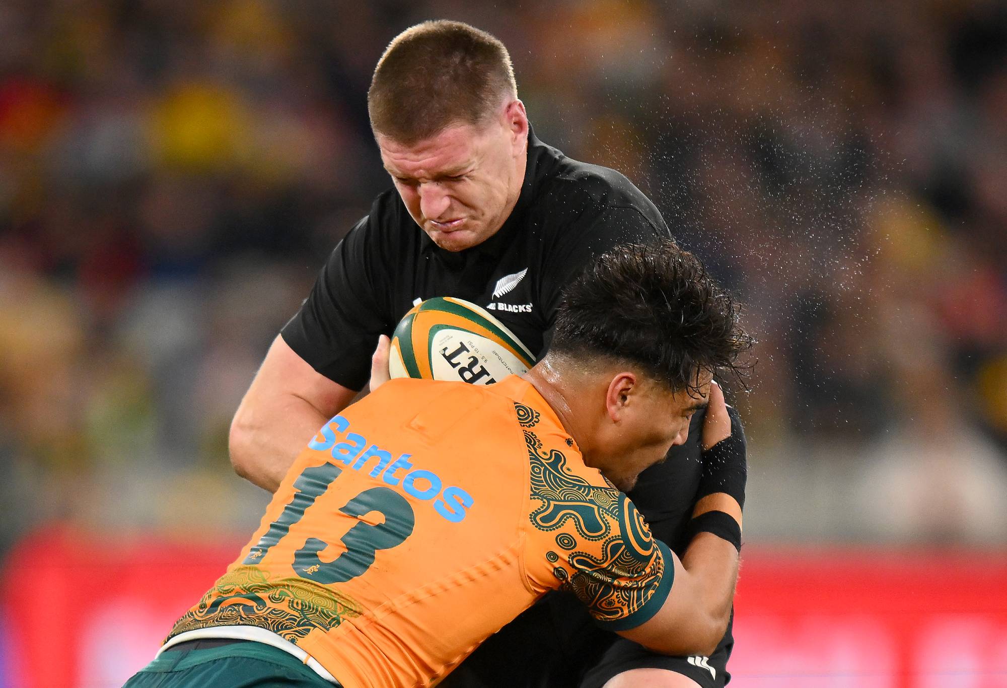Jordan Petaia of the Wallabies tackles Jordie Barrett of the All Blacks during the The Rugby Championship & Bledisloe Cup match between the Australia Wallabies and the New Zealand All Blacks at Melbourne Cricket Ground on July 29, 2023 in Melbourne, Australia. (Photo by Morgan Hancock/Getty Images)