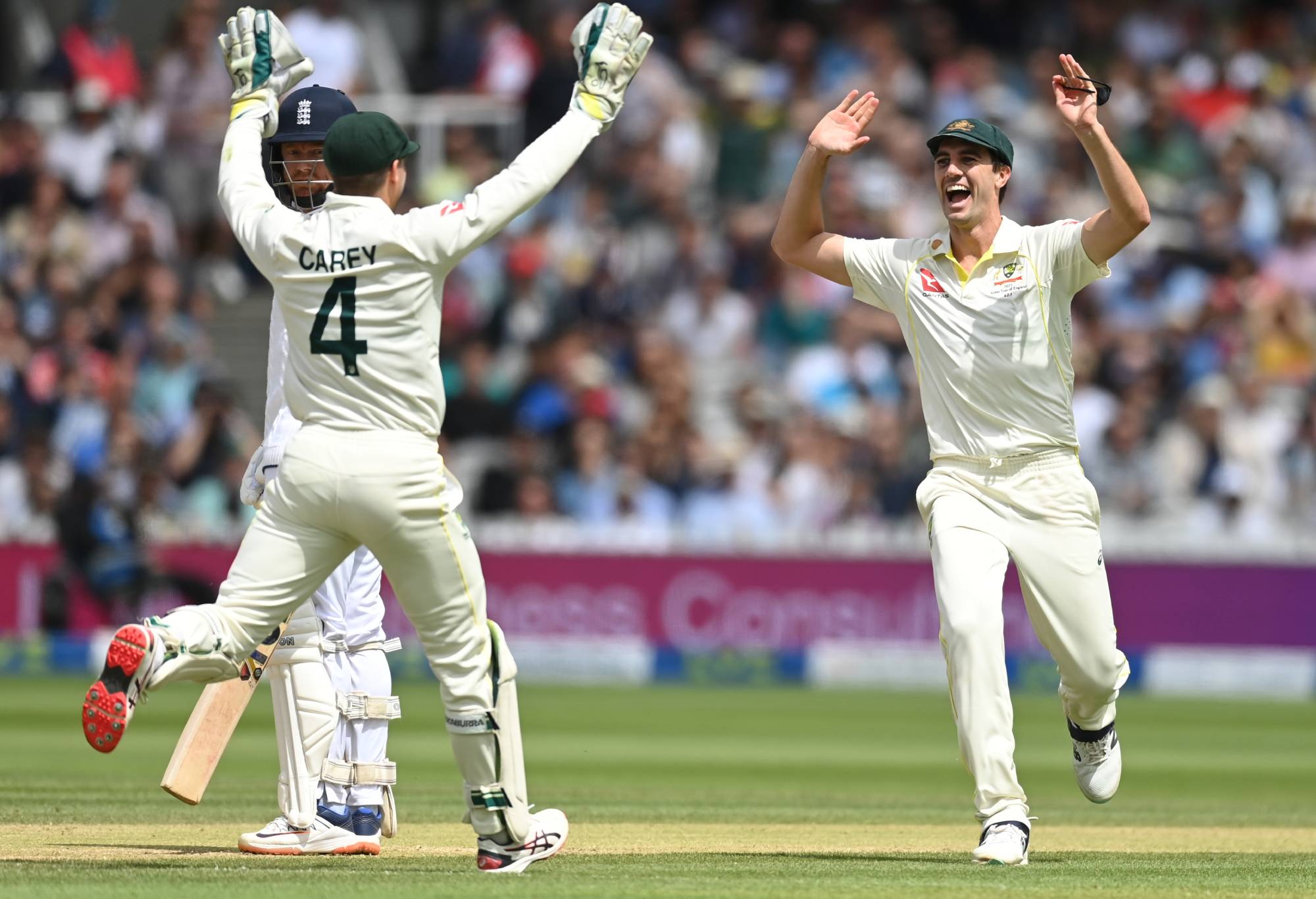 Pat Cummins of Australia and Alex Carey of Australia celebrates the wicket of Jonny Bairstow of England during Day Five of the LV= Insurance Ashes 2nd Test match between England and Australia at Lord's Cricket Ground on July 02, 2023 in London, England. (Photo by Gareth Copley/Getty Image