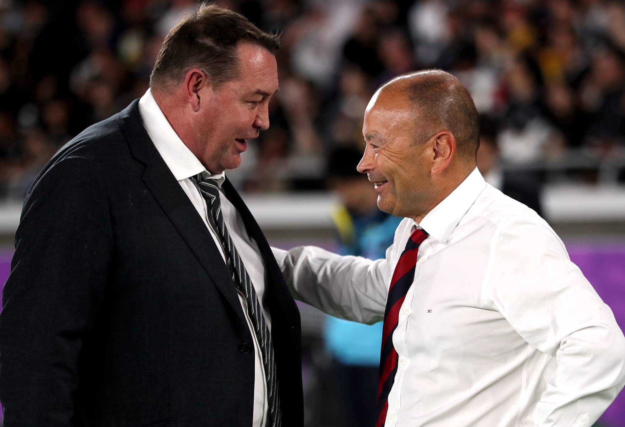 England coach Eddie Jones (left) and New Zealand coach Steve Hansen on the pitch after the 2019 Rugby World Cup Semi Final match at International Stadium Yokohama. (Photo by David Davies/PA Images via Getty Images)