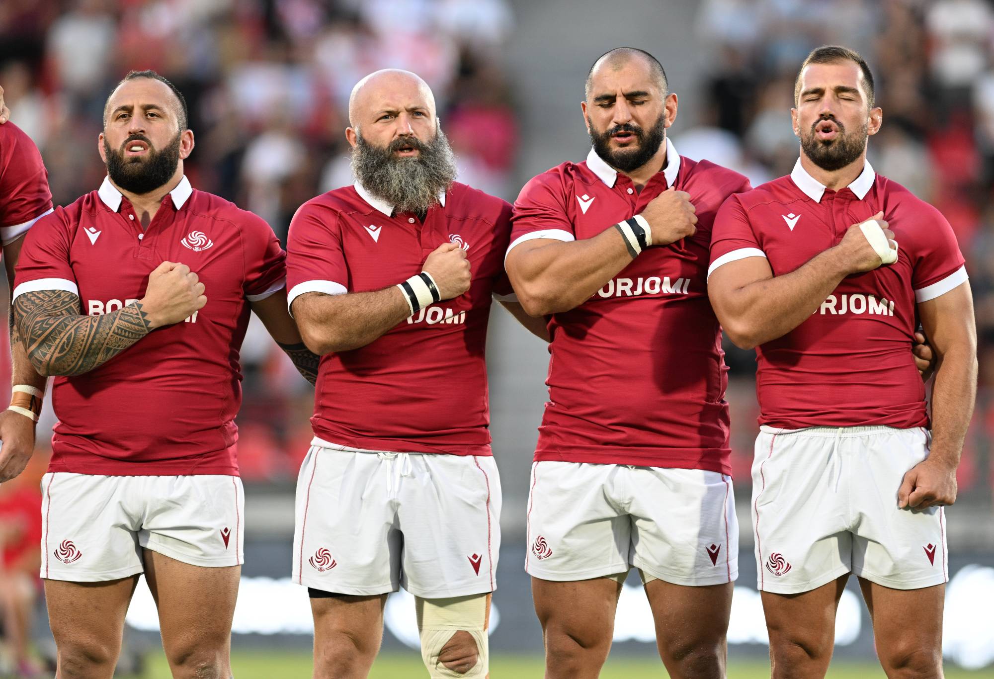 Georgian players perform the national anthem during the Summer International test match between Georgia and USA at Mikheil Meskhi stadium on August 19, 2023 in Tbilisi, Georgia. (Photo by Levan Verdzeuli/Getty Images)