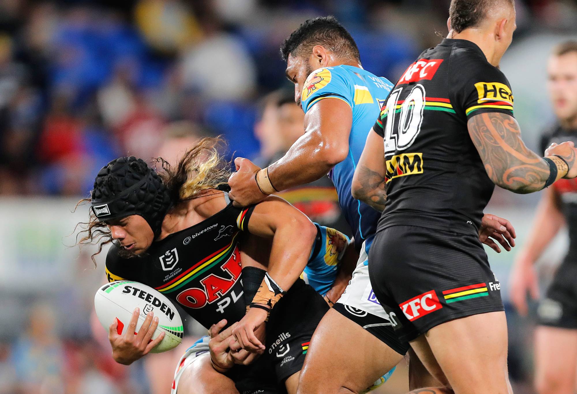 GOLD COAST, AUSTRALIA - AUGUST 19: Jarome Luai of Panthers is challenged by Jacob Alick of Titans during the round 25 NRL match between Gold Coast Titans and Penrith Panthers at Cbus Super Stadium on August 19, 2023 in Gold Coast, Australia. (Photo by Getty Images/Getty Images)