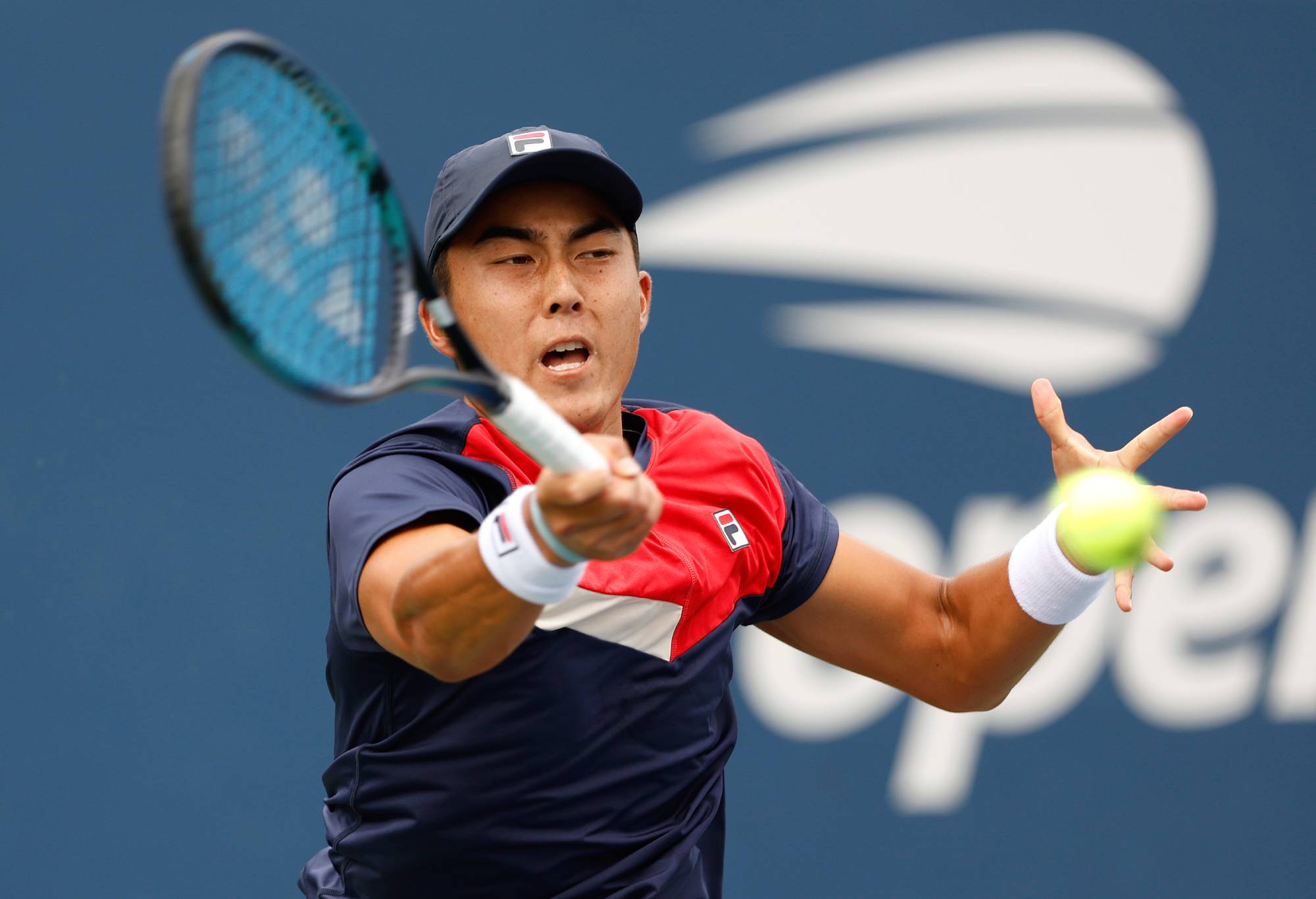 NEW YORK, NEW YORK - AUGUST 28: Rinky Hijikata of Australia returns a shot against Pavel Kotov during their Men's Singles First Round match on Day One of the 2023 US Open at the USTA Billie Jean King National Tennis Center on August 28, 2023 in the Flushing neighborhood of the Queens borough of New York City. (Photo by Sarah Stier/Getty Images)