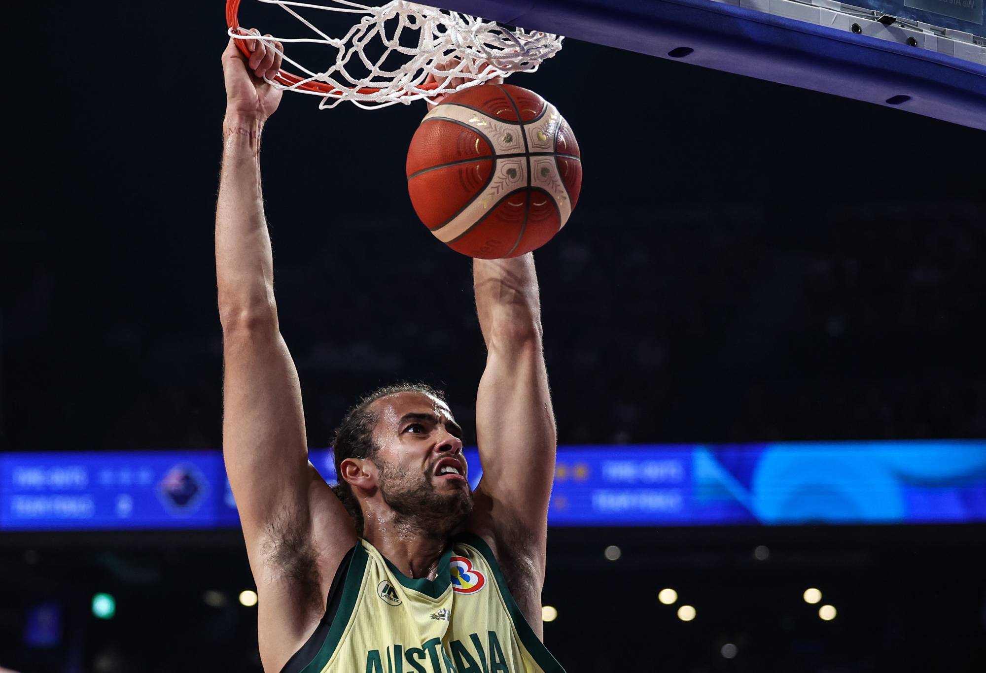 Xavier Cooks #9 of Australia dunks the ball during the FIBA Basketball World Cup Group E game between Australia and Japan at Okinawa Arena on August 29, 2023 in Okinawa, Japan. (Photo by Takashi Aoyama/Getty Images)