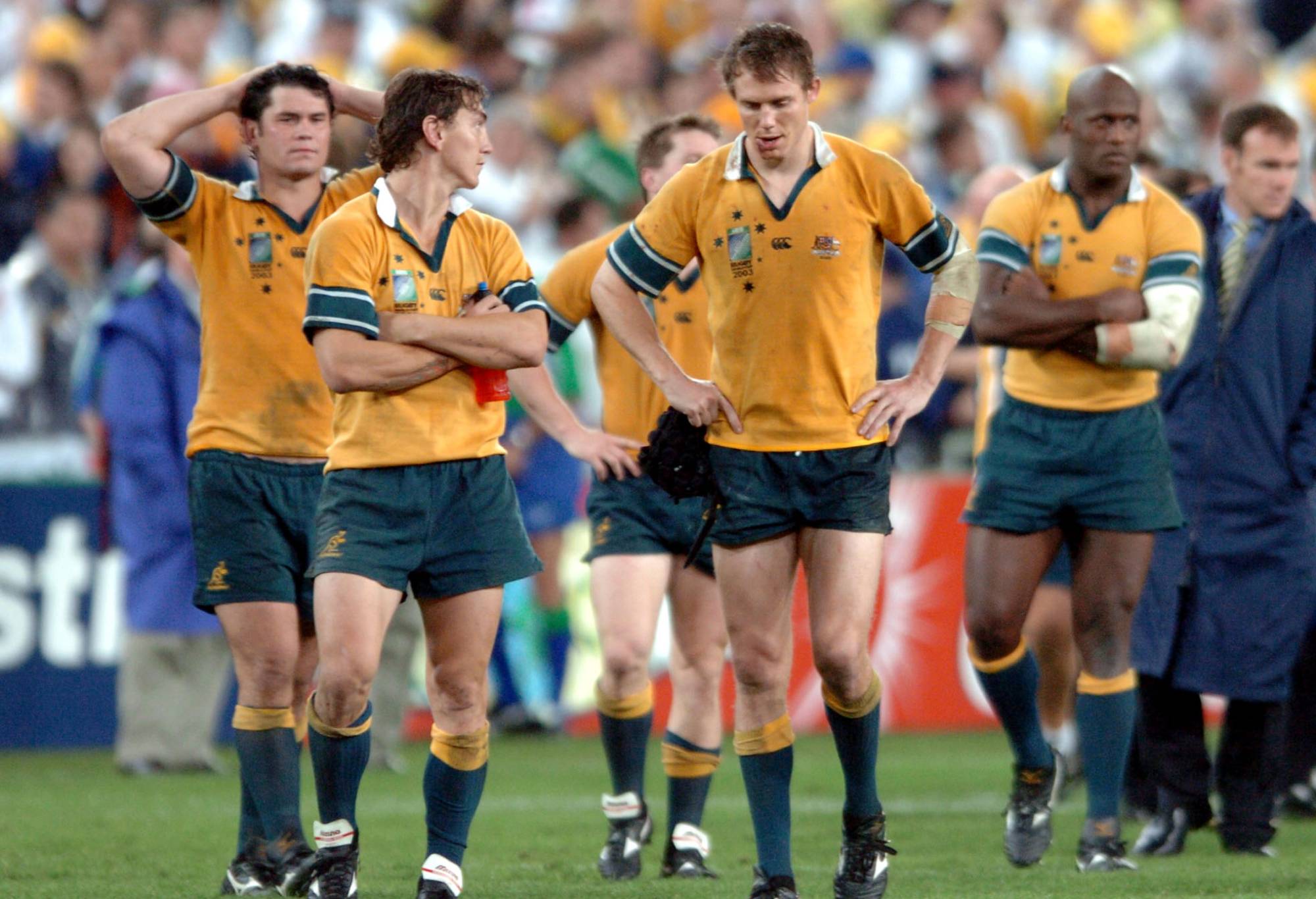 Wallabies Jeremy Paul (L), Mat Rogers, Stephen Larkham and Wendell Sailor (R) show their dissapointment following Englands 2017 win over Australia in extra time in the Rugby World Cup 2003 final at the Sydney Olympic Stadium, Saturday. (Photo by Ross Land/Getty Images)