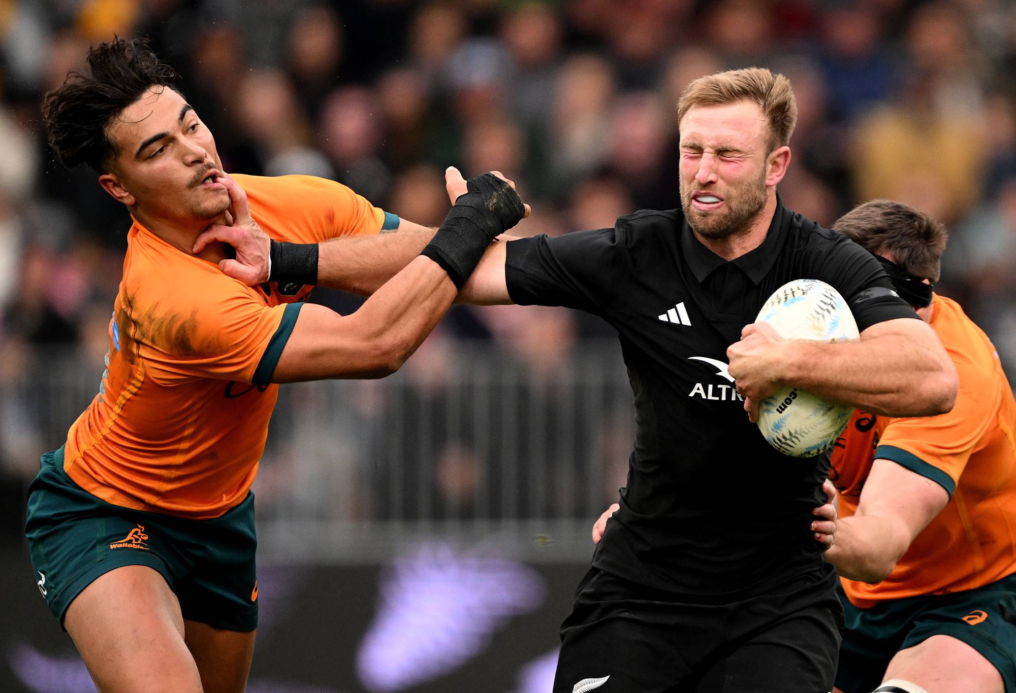 Braydon Ennor of New Zealand fends off Jordan Petaia of Australia during The Rugby Championship & Bledisloe Cup match between the New Zealand All Blacks and the Australia Wallabies at Forsyth Barr Stadium on August 05, 2023 in Dunedin, New Zealand. (Photo by Joe Allison/Getty Images)