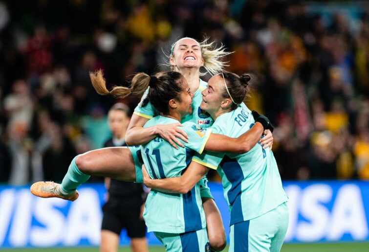 Mary Fowler of Australia (L) celebrating her goal with her teammates Ellie Carpenter (C) and Caitlin Foord of Australia (R) during the FIFA Women's World Cup Australia & New Zealand 2023 Group B match between Canada and Australia at Melbourne Rectangular Stadium on July 31, 2023 in Melbourne, Australia. (Photo by Richard Callis/Eurasia Sport Images/Getty Images)