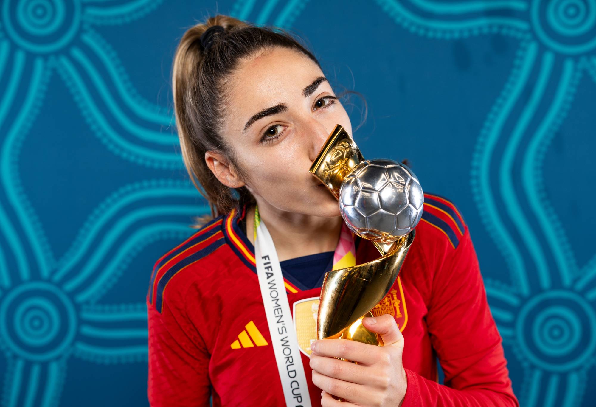 Olga Carmona of Spain poses with the FIFA Women's World Cup Australia & New Zealand 2023 trophy after victory in the FIFA Women's World Cup Australia & New Zealand 2023 Final match between Spain and England at Stadium Australia on August 20, 2023 in Sydney / Gadigal, Australia. (Photo by Maddie Meyer - FIFA/FIFA via Getty Images)
