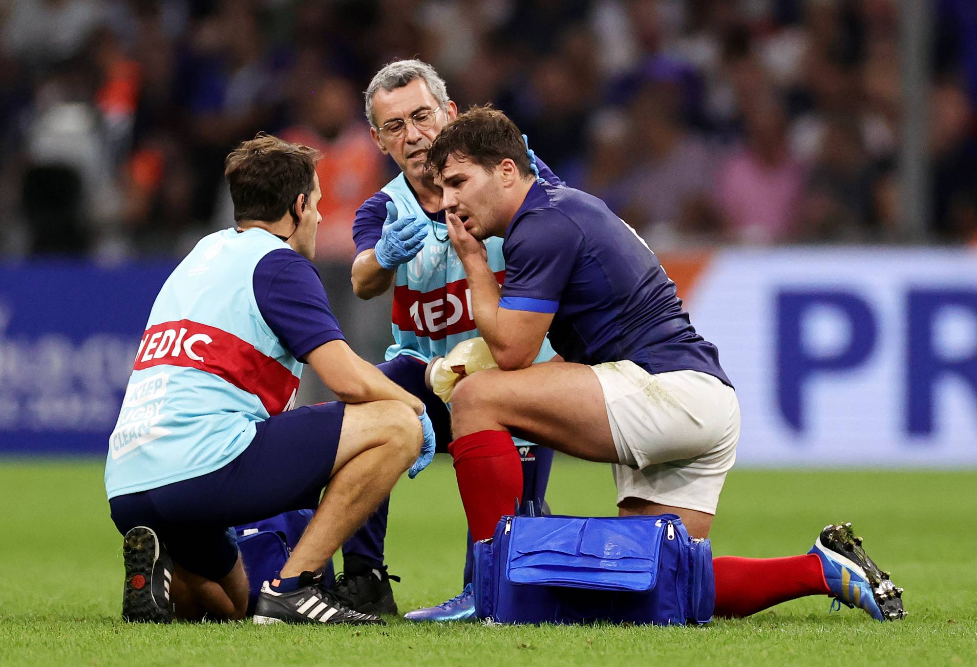 Antoine Dupont of France receives medical treatment following head contact with Johan Deysel of Namibia (not pictured) during the Rugby World Cup France 2023 match between France and Namibia at Stade Velodrome on September 21, 2023 in Marseille, France. (Photo by David Rogers/Getty Images) France v Namibia - Rugby World Cup France 2023 Embed Com