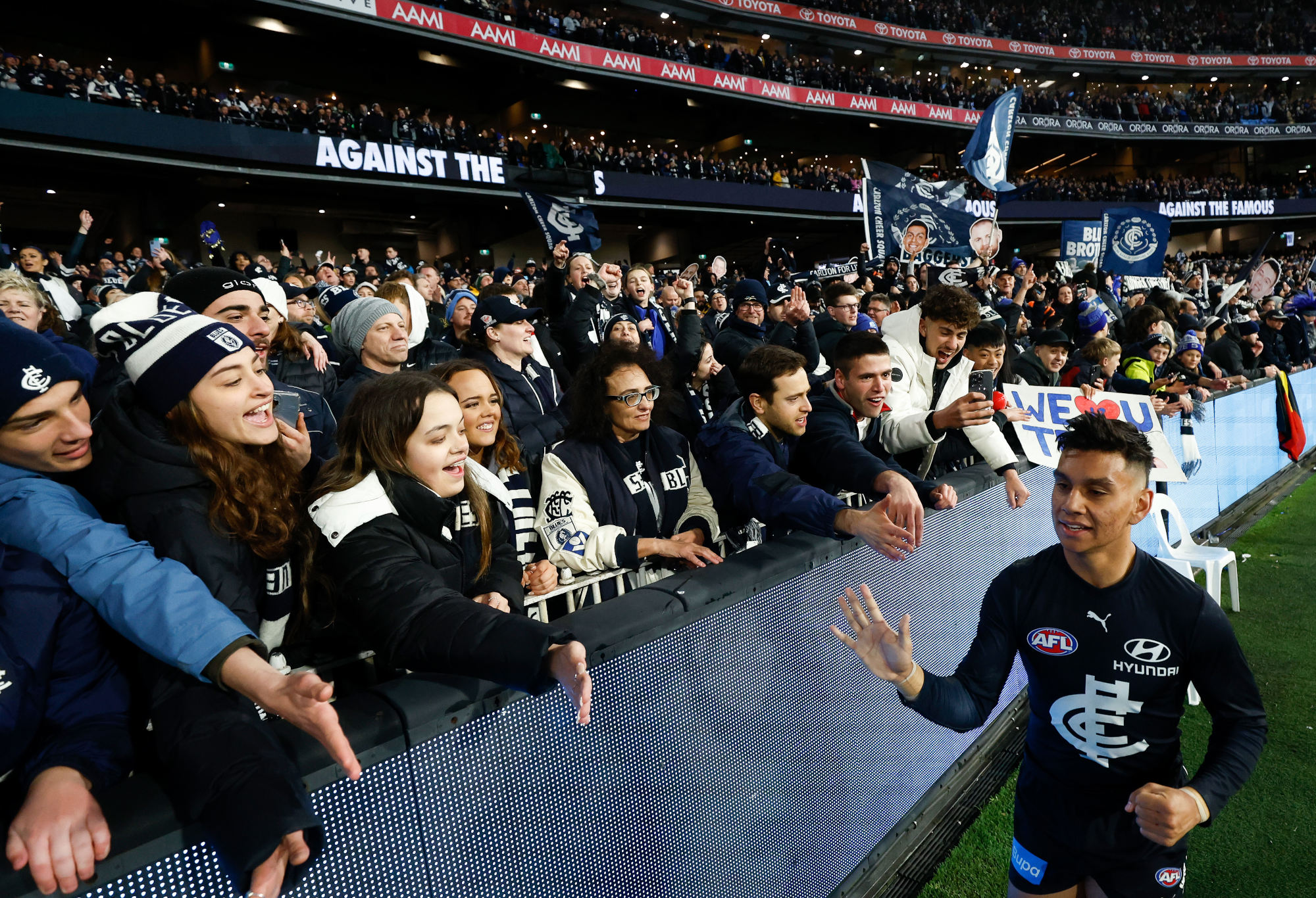 Jesse Motlop of the Blues celebrates with fans during the 2023 AFL First Elimination Final match between the Carlton Blues and the Sydney Swans at Melbourne Cricket Ground on September 08, 2023 in Melbourne, Australia. (Photo by Michael Willson/AFL Photos via Getty Images)