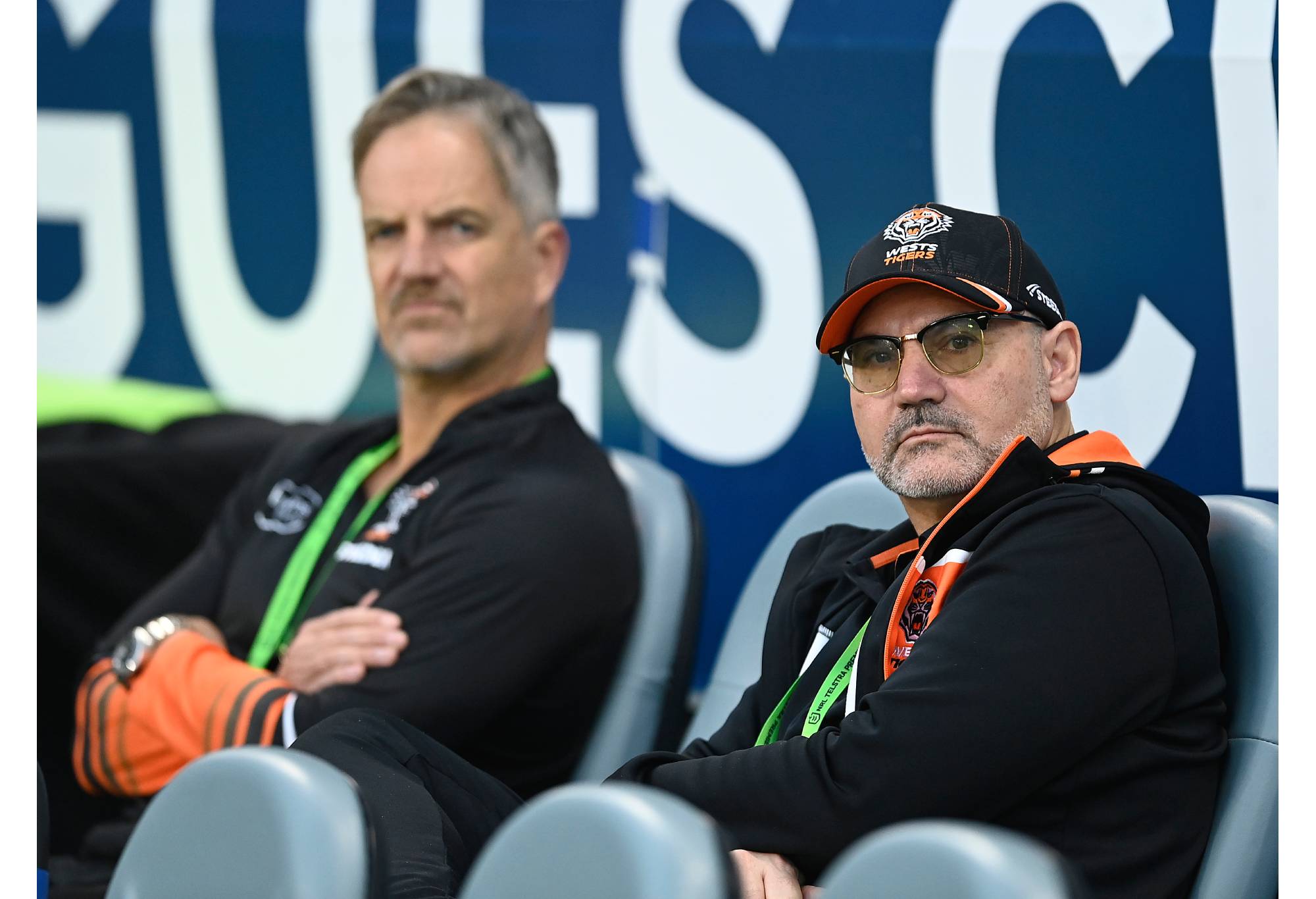 TOWNSVILLE, AUSTRALIA - JULY 01: West Tigers Board Director Lee Hagipantelis and CEO Justin Pascoe look on before the start of the round 18 NRL match between North Queensland Cowboys and Wests Tigers at Qld Country Bank Stadium on July 01, 2023 in Townsville, Australia. (Photo by Ian Hitchcock/Getty Images)